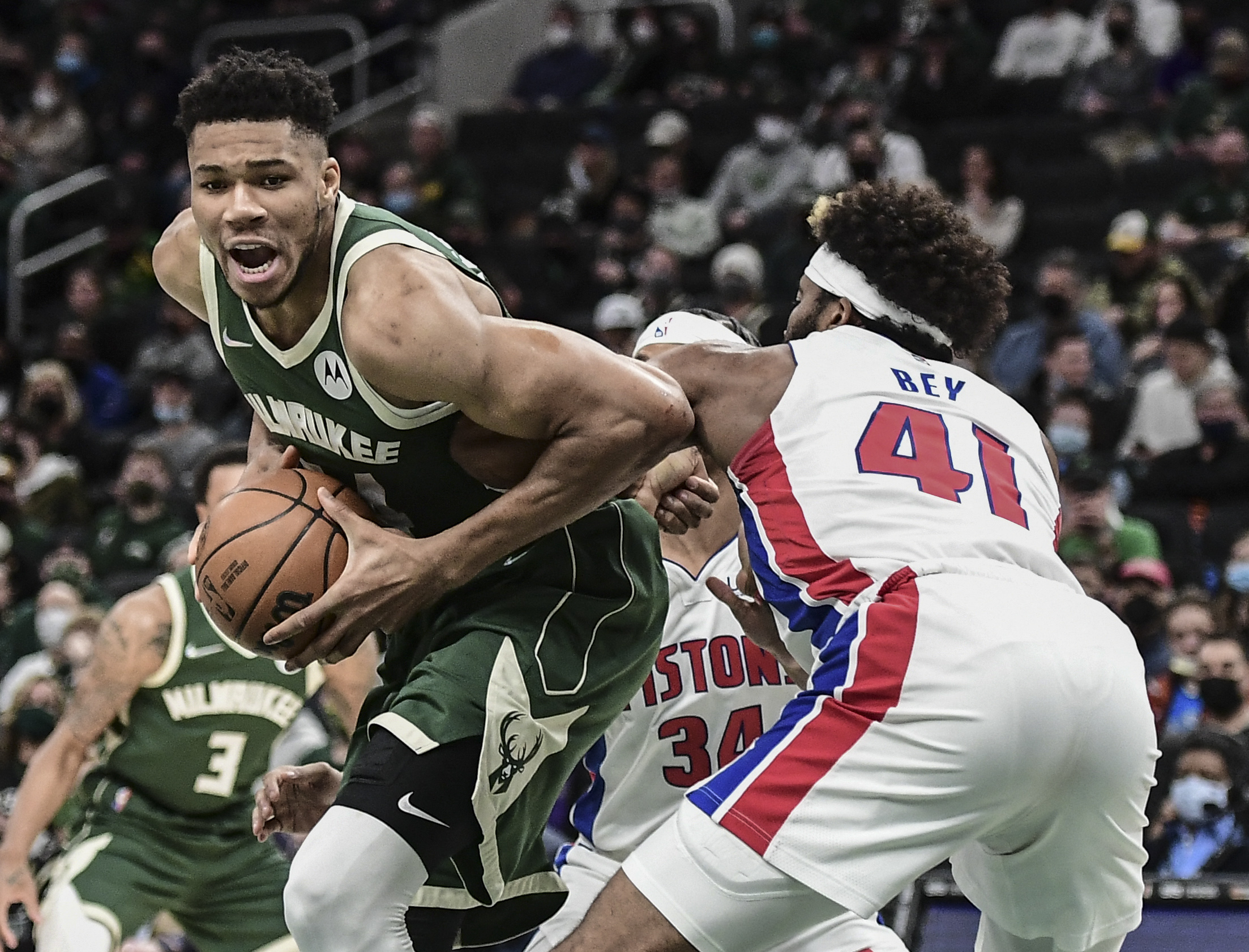 Jan 3, 2022; Milwaukee, Wisconsin, USA; Milwaukee Bucks forward Giannis Antetokounmpo (34) drives for the basket against Detroit Pistons forward Saddiq Bey (41) in the first quarter at Fiserv Forum. Mandatory Credit: Benny Sieu-USA TODAY Sports