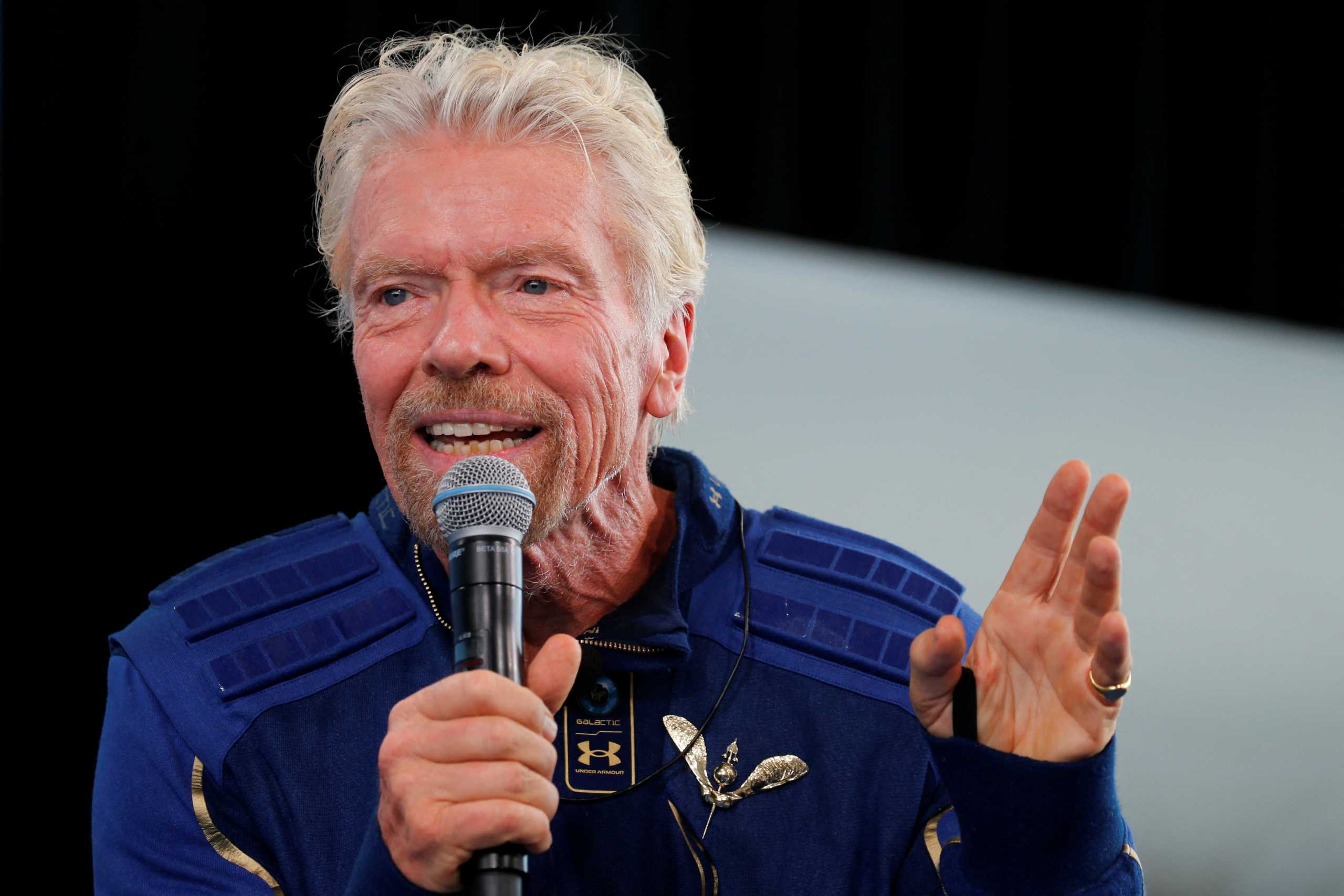 FILE PHOTO: Billionaire entrepreneur Richard Branson wears his astronaut's wings at a news conference, after flying with a crew in Virgin Galactic's passenger rocket plane VSS Unity to the edge of space at Spaceport America near Truth or Consequences, New Mexico, U.S., July 11, 2021. REUTERS
