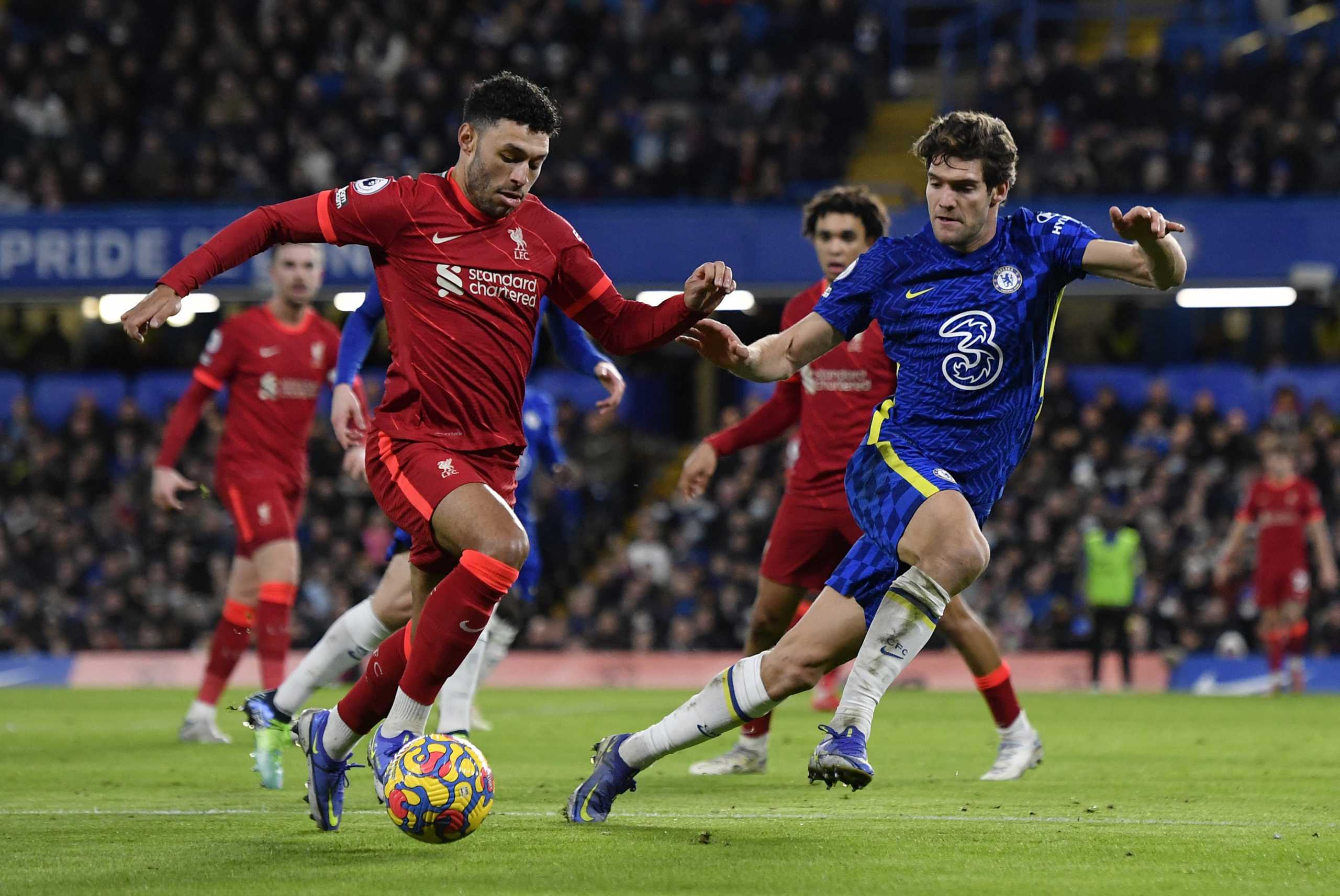 Soccer Football - Premier League - Chelsea v Liverpool - Stamford Bridge, London, Britain - January 2, 2022 Liverpool's Alex Oxlade-Chamberlain in action with Chelsea's Marcos Alonso REUTERS
