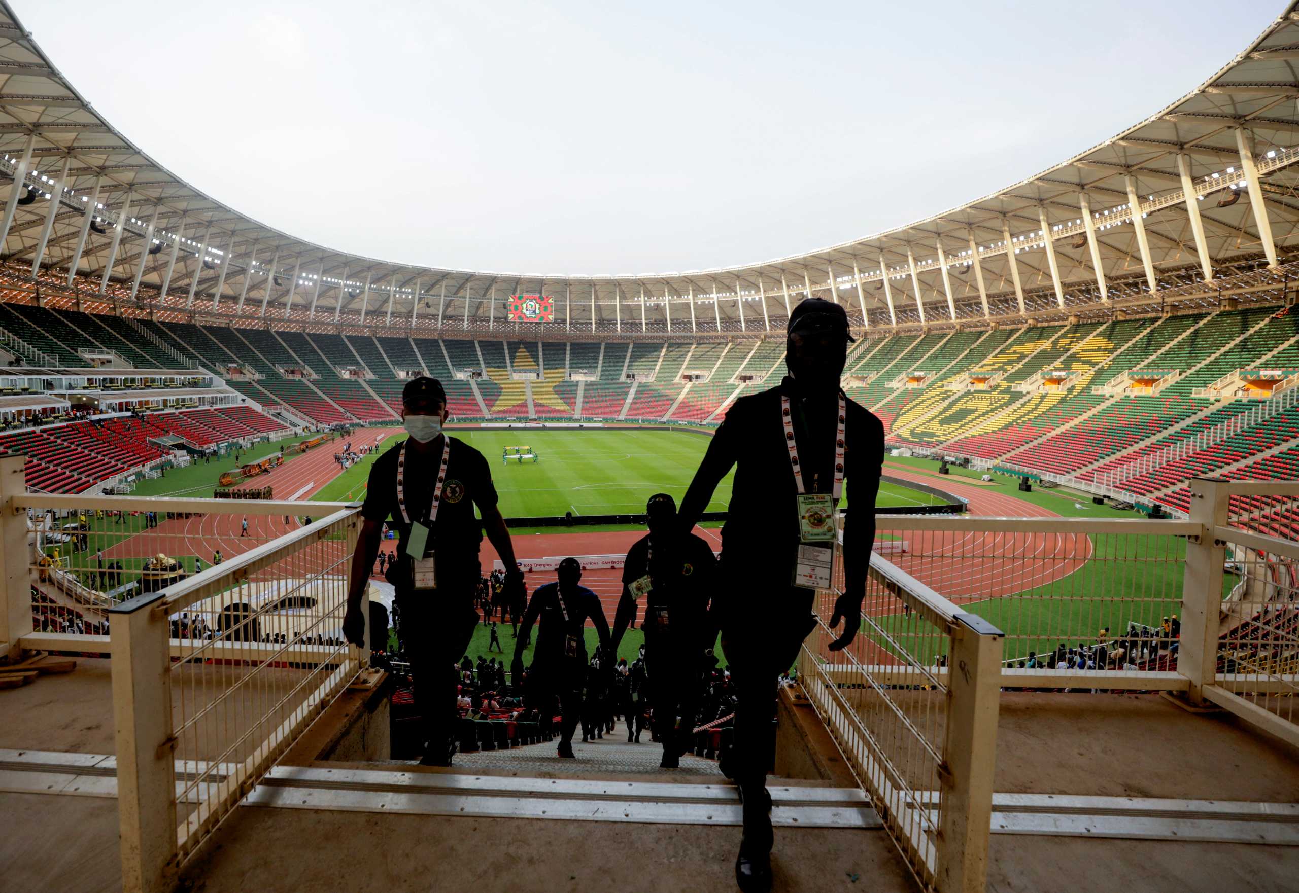 People walk up the stands at the Olembe Stadium, which is to host the opening ceremony of the Africa Cup of Nations (AFCON), in Yaounde, Cameroon January 8, 2022. REUTERS