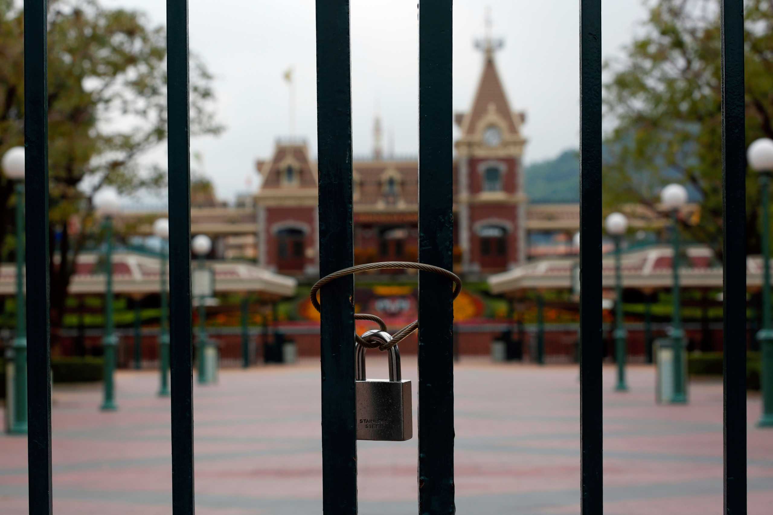 A locked gate is seen after the Hong Kong Disneyland theme park has been closed, following the coronavirus outbreak in Hong Kong, China January 26, 2020. REUTERS