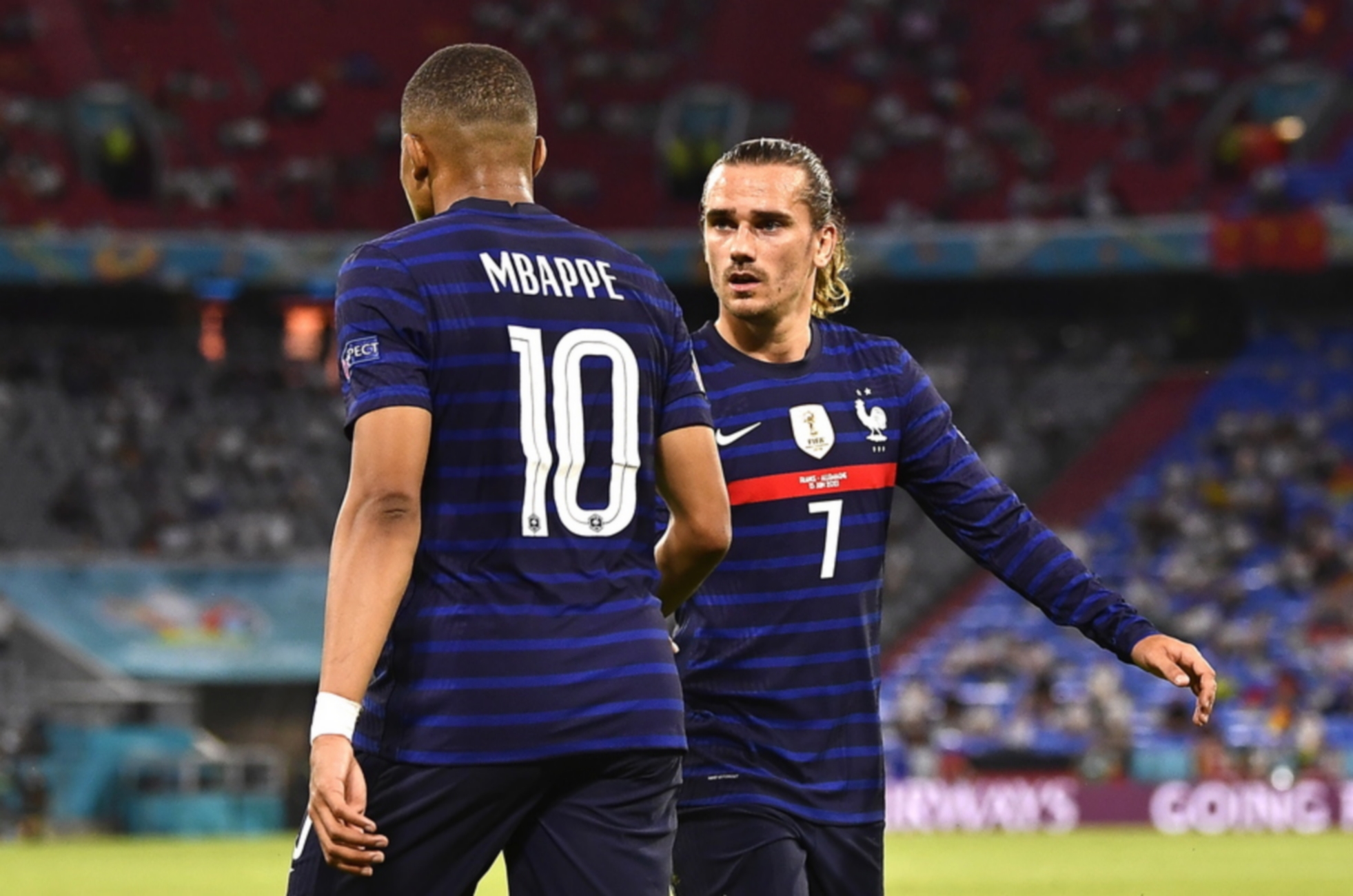 epa09274547 French players Kylian Mbappe (L) and Antoine Griezmann (R) react during the UEFA EURO 2020 group F preliminary round soccer match between France and Germany in Munich, Germany, 15 June 2021.  EPA