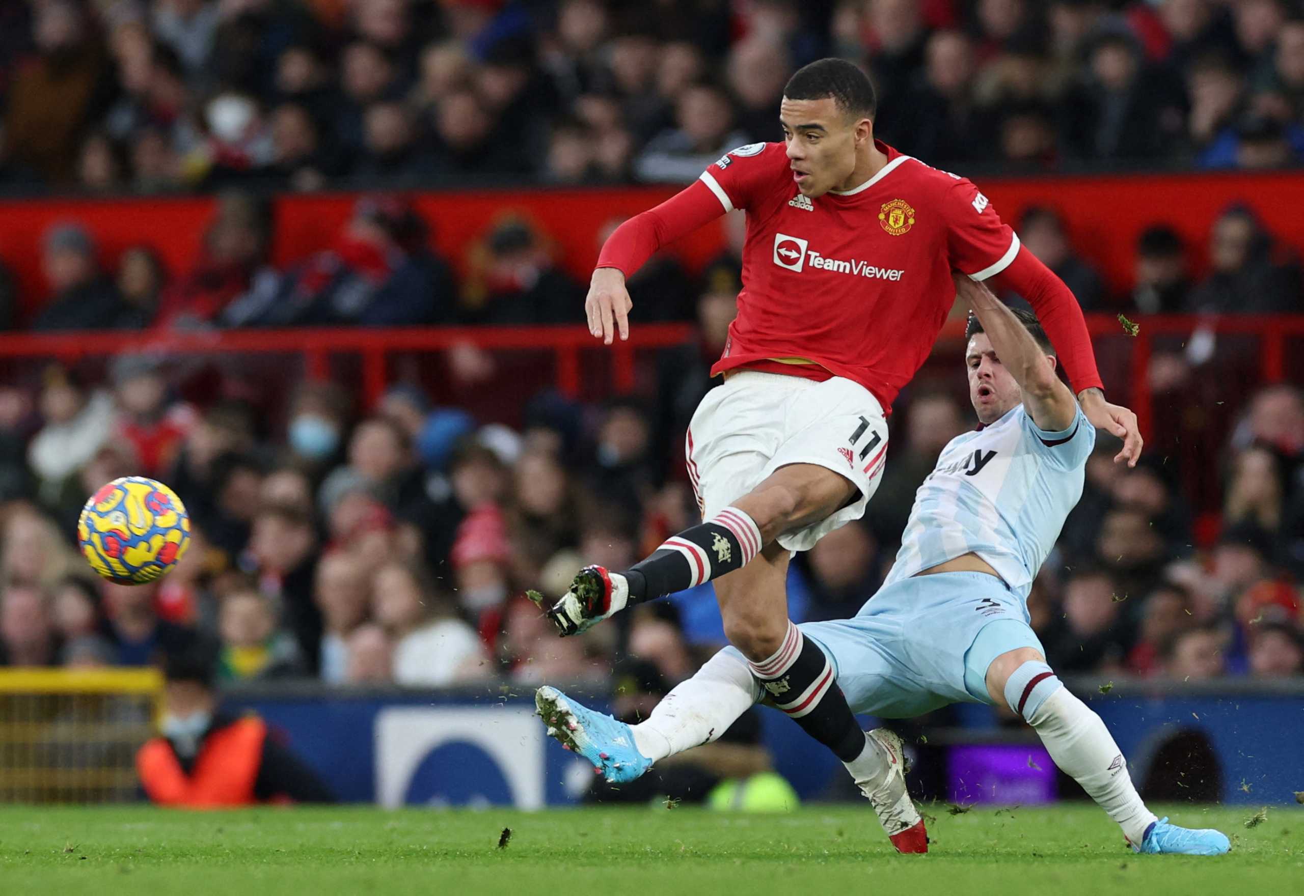 FILE PHOTO: Soccer Football - Premier League - Manchester United v West Ham United - Old Trafford, Manchester, Britain - January 22, 2022 Manchester United's Mason Greenwood in action with West Ham United's Aaron Cresswell REUTERS
