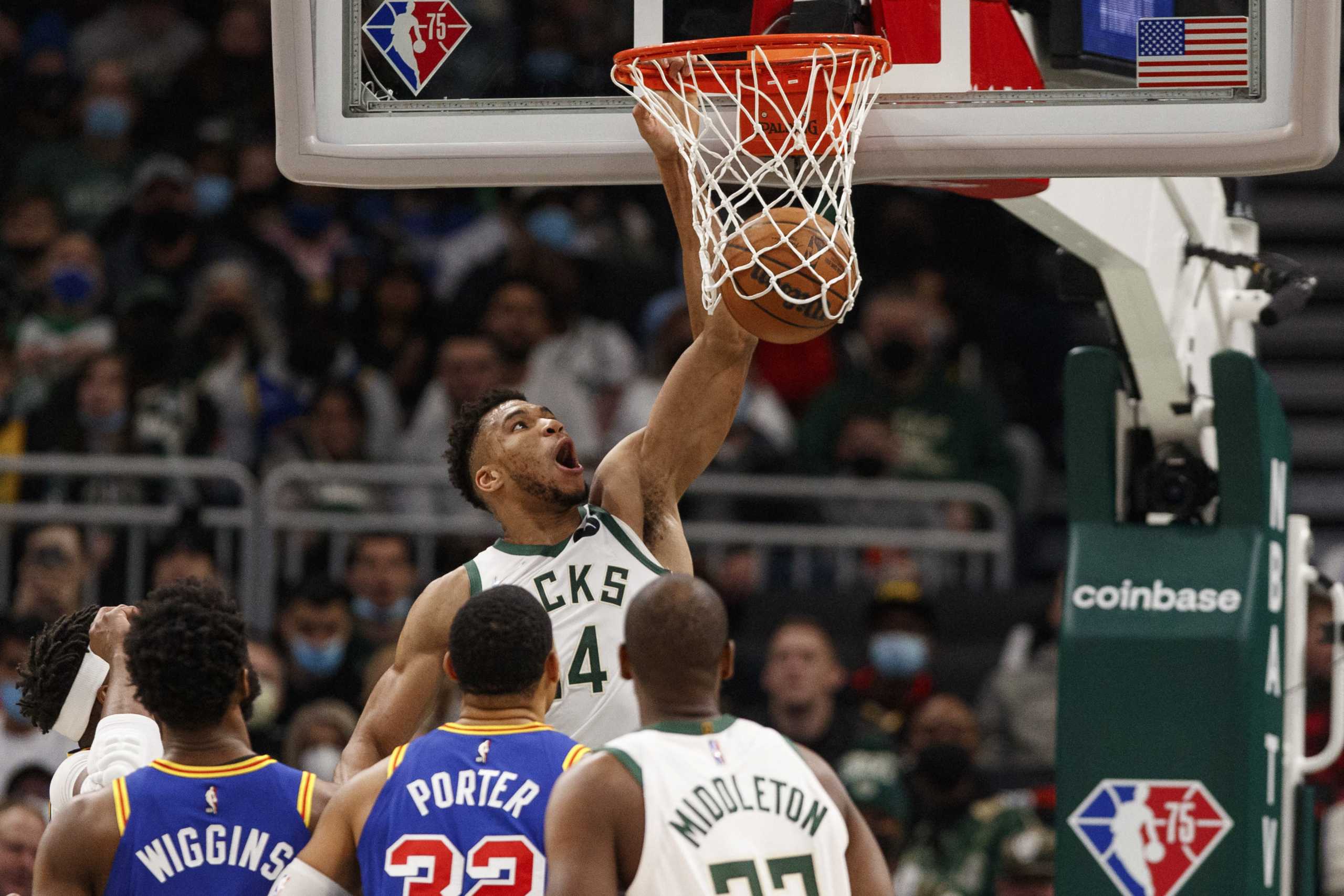 Jan 13, 2022; Milwaukee, Wisconsin, USA;  Milwaukee Bucks forward Giannis Antetokounmpo (34) dunks during the second quarter against the Golden State Warriors at Fiserv Forum. Mandatory Credit: Jeff Hanisch-USA TODAY Sports