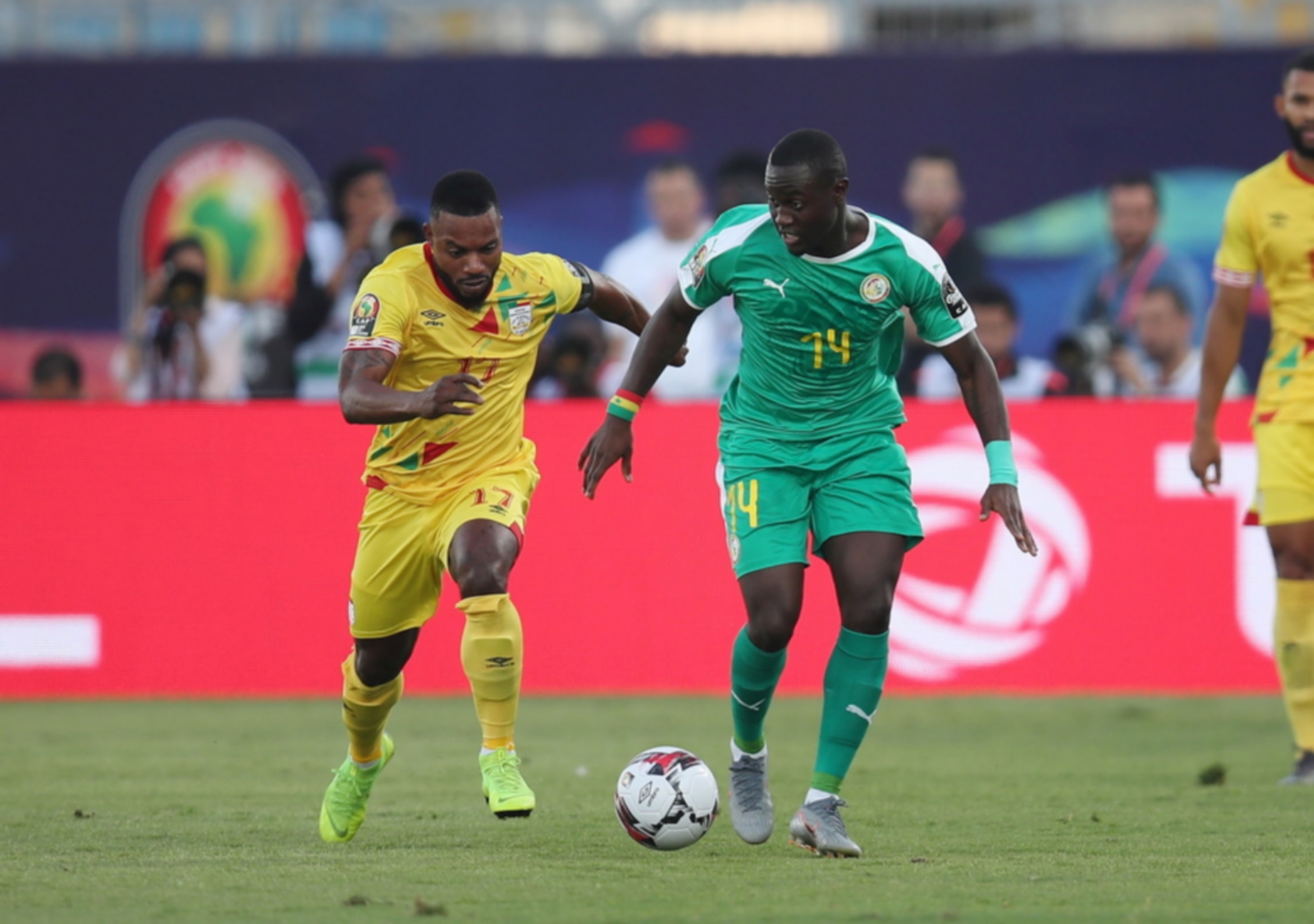 epa07708378 Henri Saivet of Senegal challenged by Moise Adilehou of Benin during the 2019 Africa Cup of Nations Quarterfinals match between Senegal and Benin at the 30 June Stadium, Cairo, Egypt, 10 July 2019.  EPA