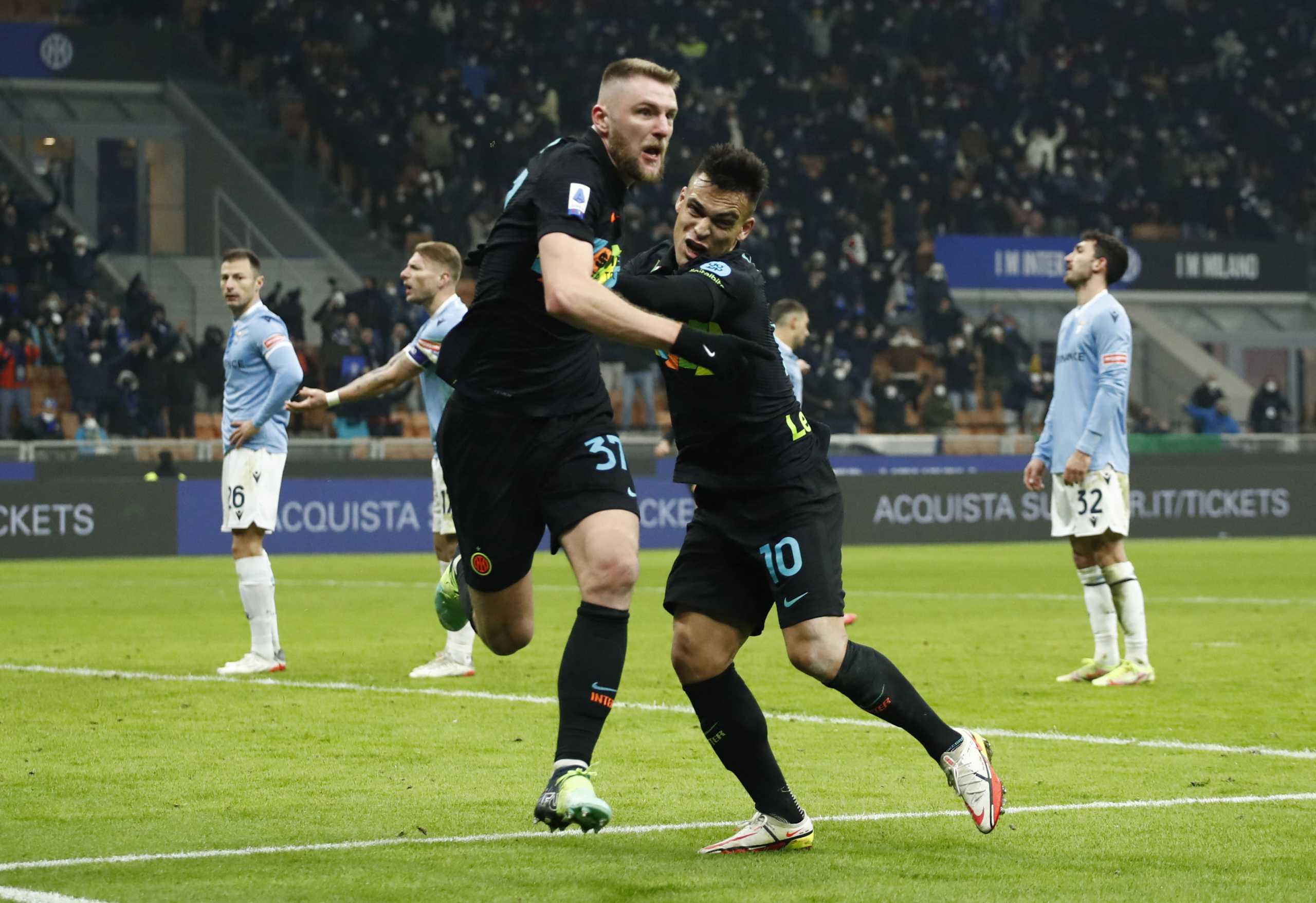 Soccer Football - Serie A - Inter Milan v Lazio - San Siro, Milan, Italy - January 9, 2022 Inter Milan's Milan Skriniar celebrates scoring their second goal with  Lautaro Martinez REUTERS