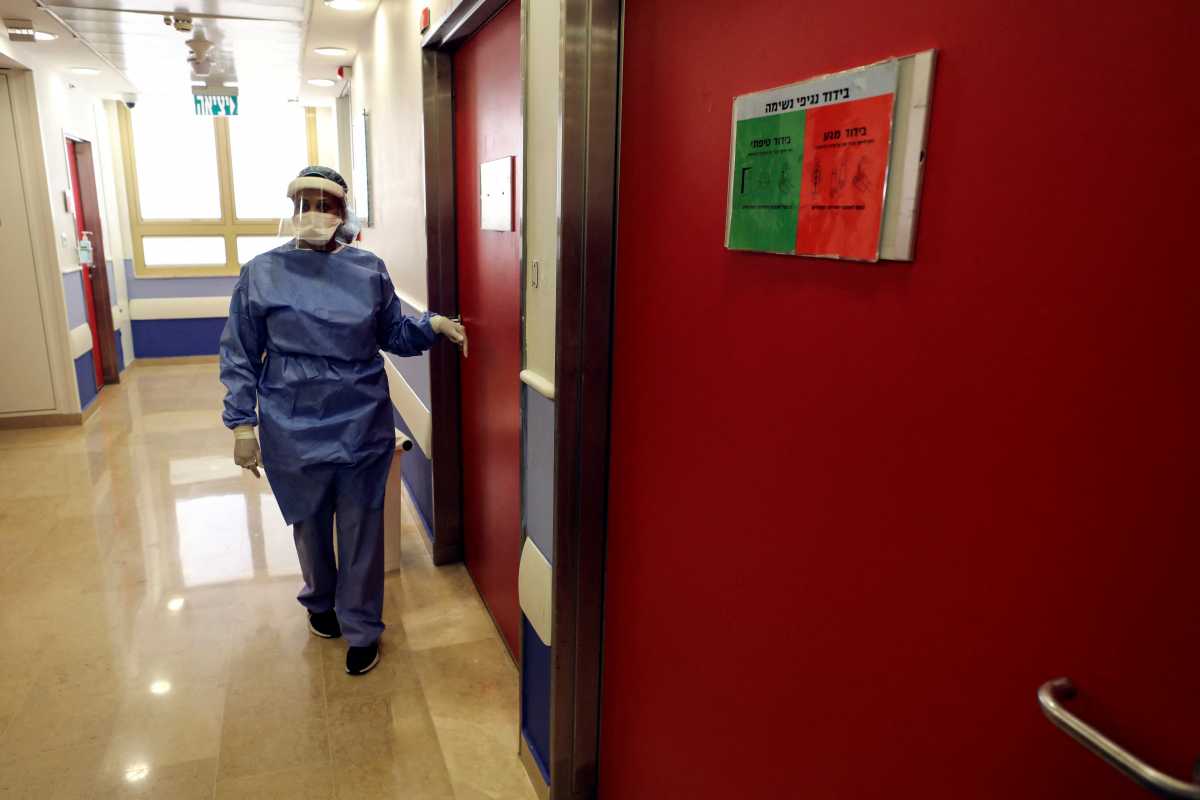 A medical worker walks through a dedicated children's coronavirus disease (COVID-19) ward which reopened as a response to increased infections among Israel's children at Sheba Medical Center in Ramat Gan, Israel January 11, 2022. REUTERS