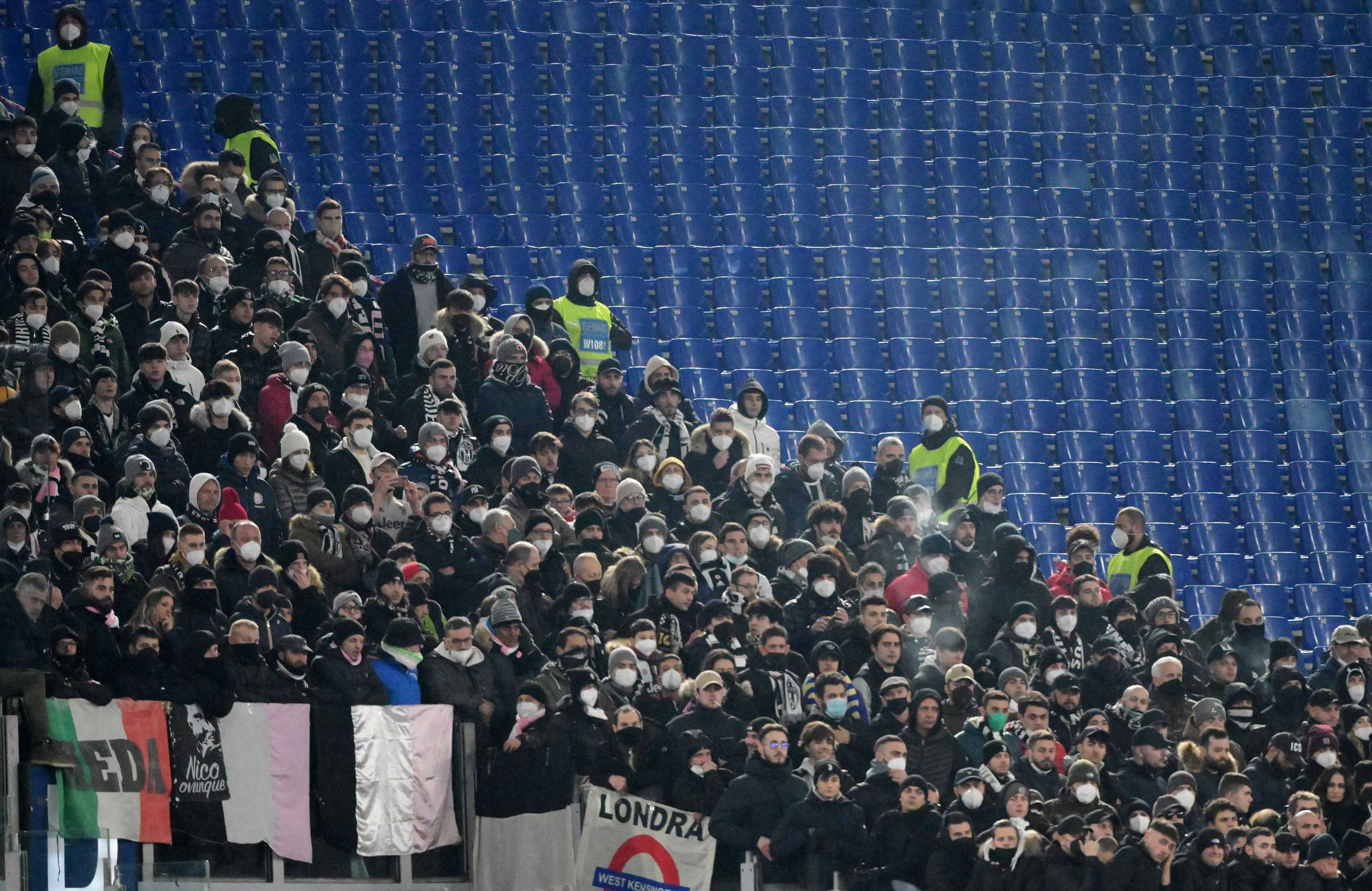 Soccer Football - Serie A - AS Roma v Juventus - Stadio Olimpico, Rome, Italy - January 9, 2022 AS Roma fans wearing protective face masks during the match REUTERS