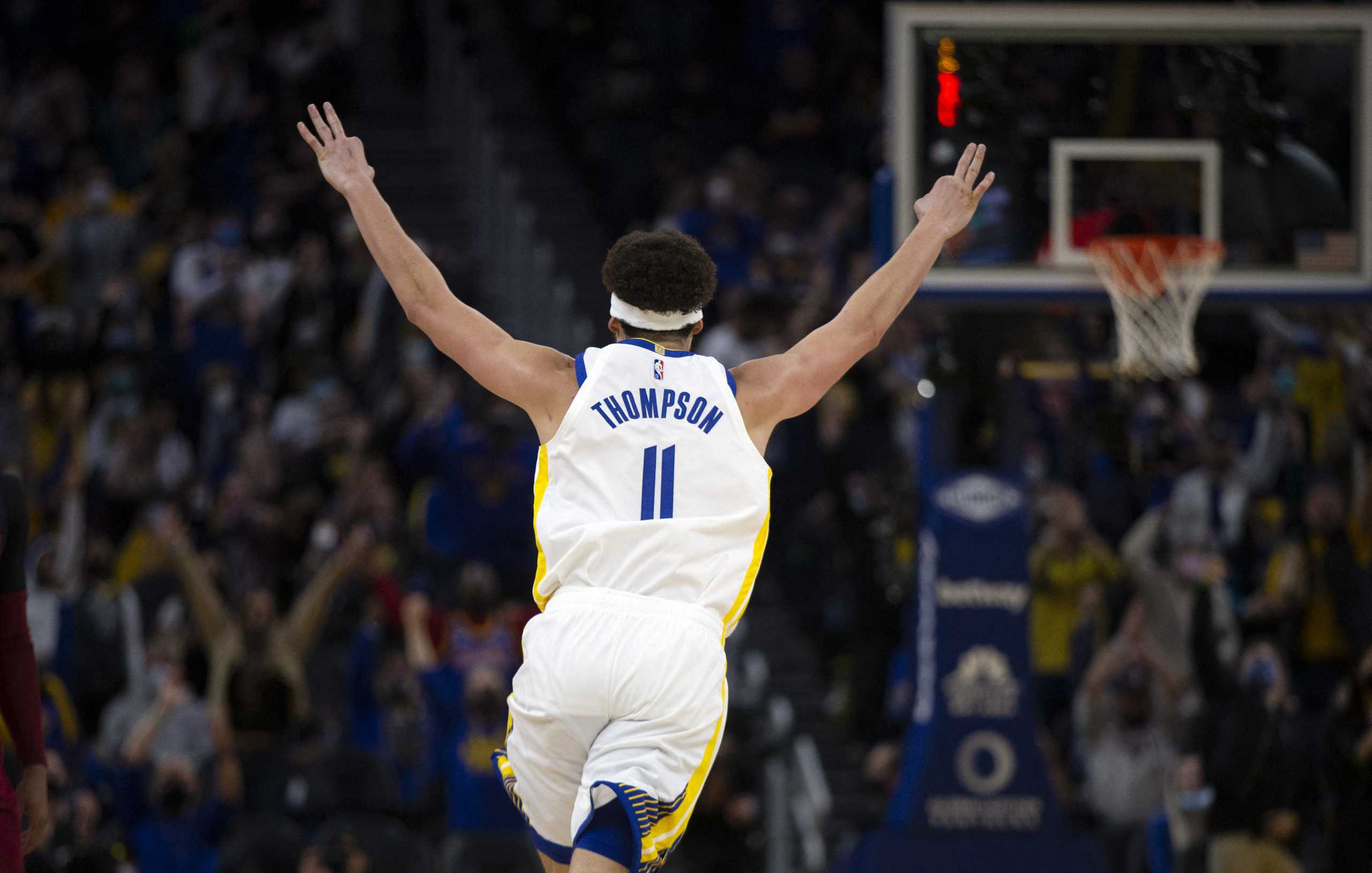 Jan 9, 2022; San Francisco, California, USA; Golden State Warriors guard Klay Thompson (11) celebrates his 1800th career three-point basket during the third quarter against the Cleveland Cavaliers at Chase Center. Mandatory Credit: D. Ross Cameron-USA TODAY Sports