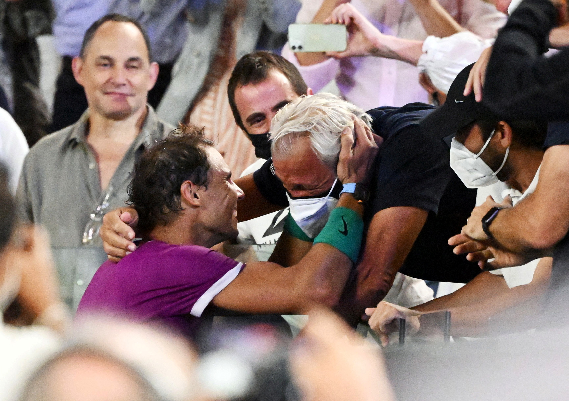 Tennis - Australian Open - Men's Singles Final - Melbourne Park, Melbourne, Australia - January 31, 2022 Spain's Rafael Nadal celebrates with his father Sebastian Nadal after winning the final against Russia's Daniil Medvedev REUTERS