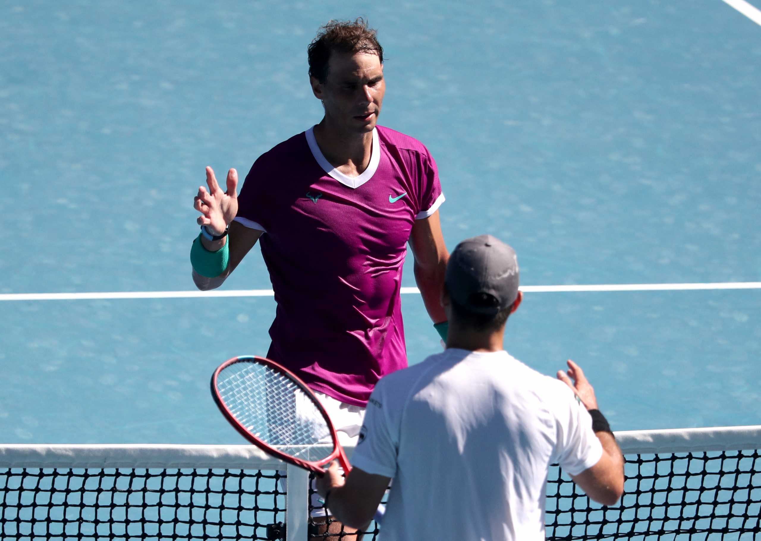 Tennis - Australian Open - Melbourne Park, Melbourne, Australia - January 17, 2022 Spain's Rafael Nadal shakes hands with Marcos Giron of the U.S. after their first round match REUTERS