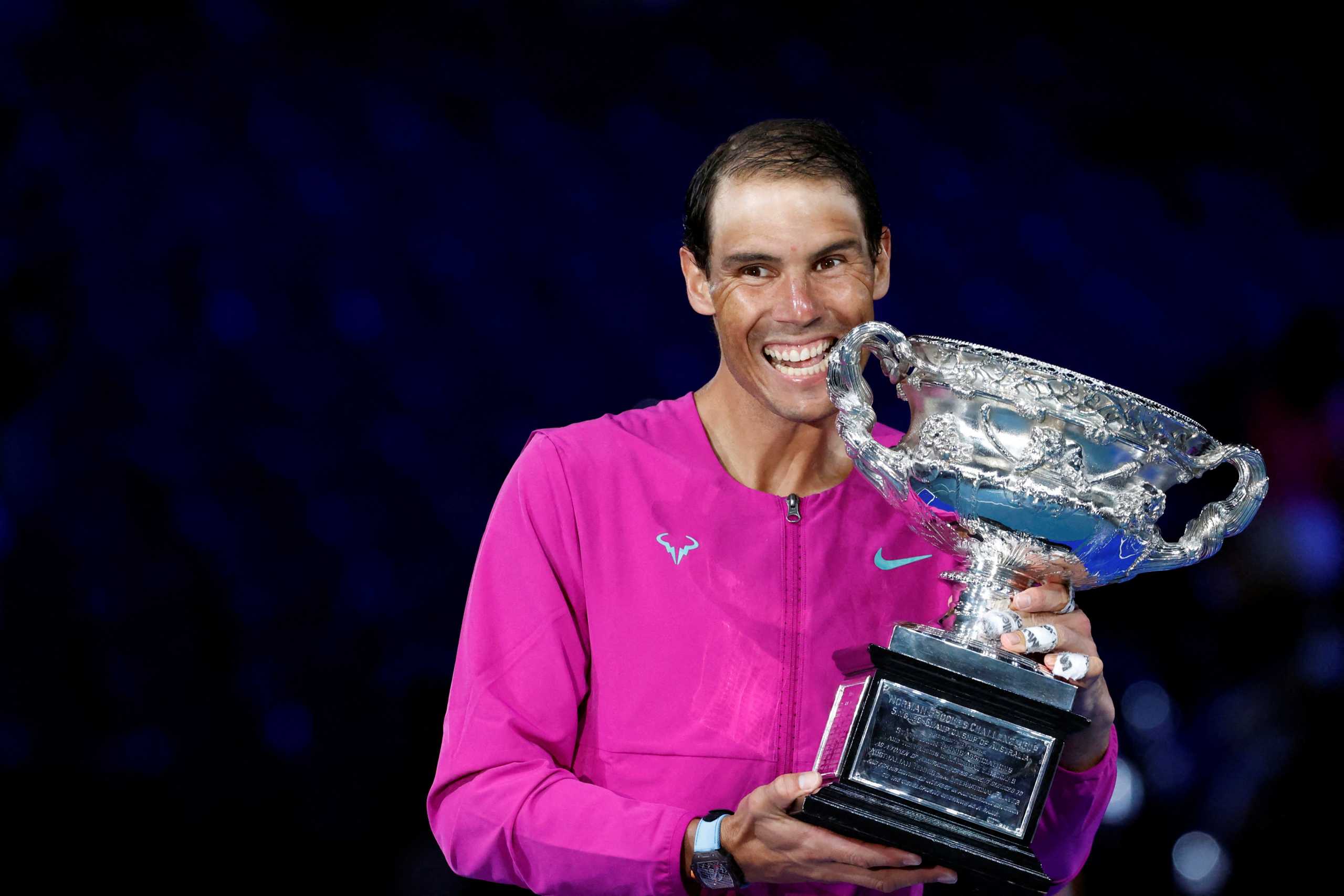 Tennis - Australian Open - Men's Singles Final - Melbourne Park, Melbourne, Australia - January 31, 2022 Spain's Rafael Nadal celebrates after winning the men's singles final with trophy REUTERS
