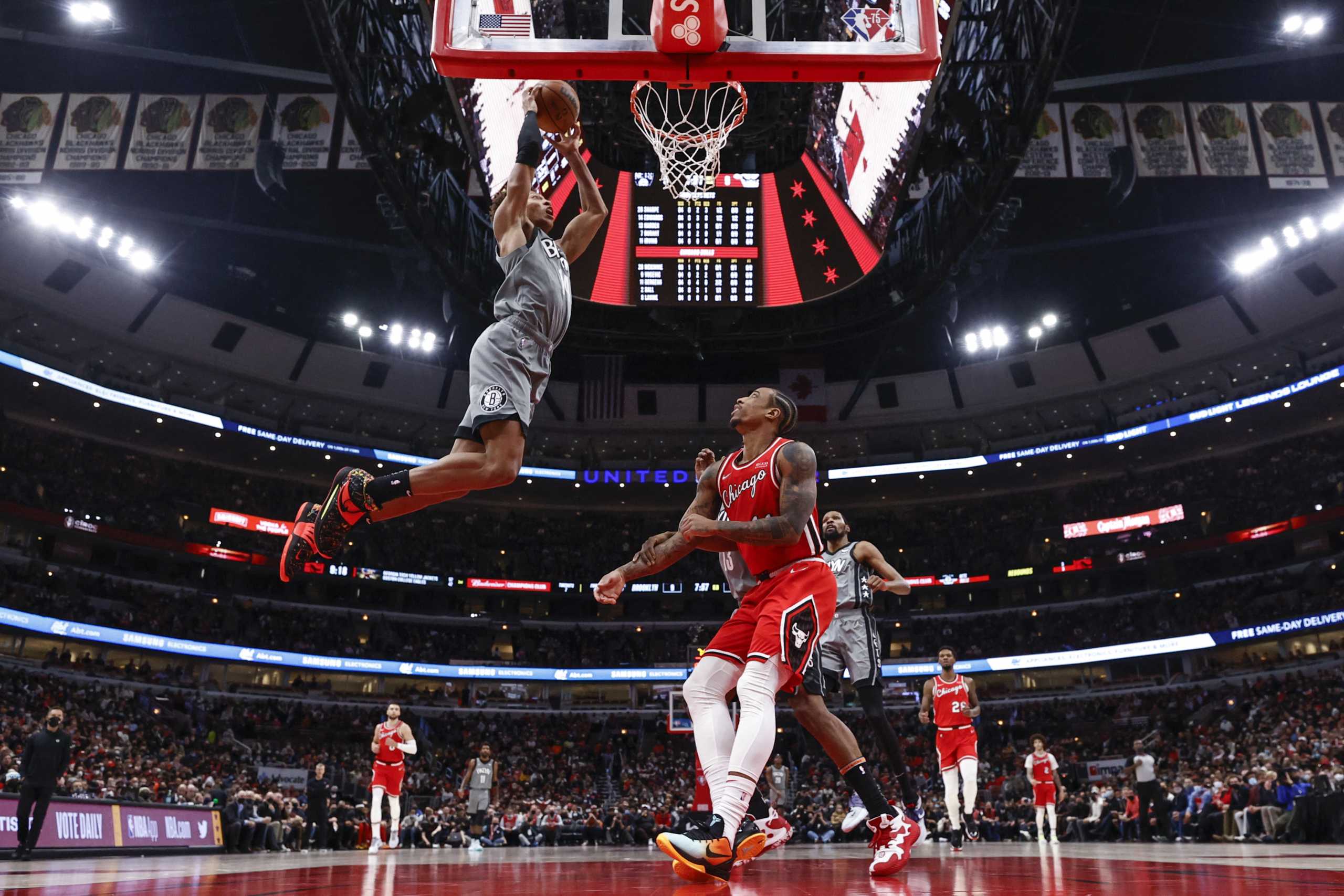Jan 12, 2022; Chicago, Illinois, USA; Brooklyn Nets forward Kessler Edwards (14) goes up for a dunk against the Chicago Bulls during the first half at United Center. Mandatory Credit: Kamil Krzaczynski-USA TODAY Sports