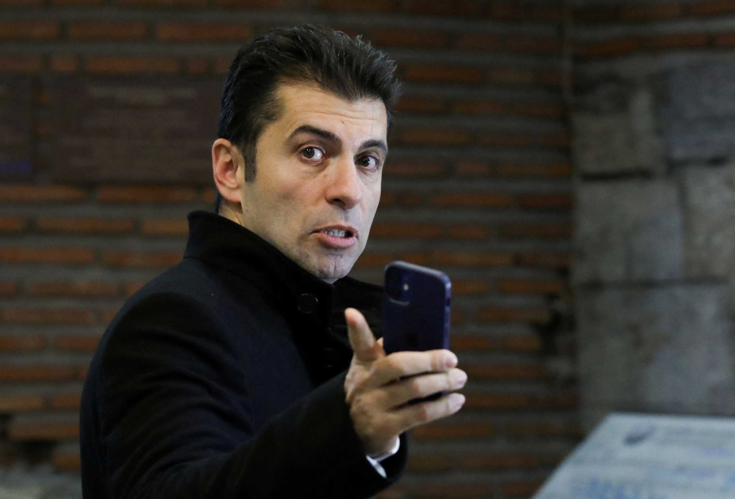 FILE PHOTO: Bulgaria's Prime Minister Kiril Petkov gestures as he walks towards the government building after being elected, in Sofia, Bulgaria, December 13, 2021. REUTERS