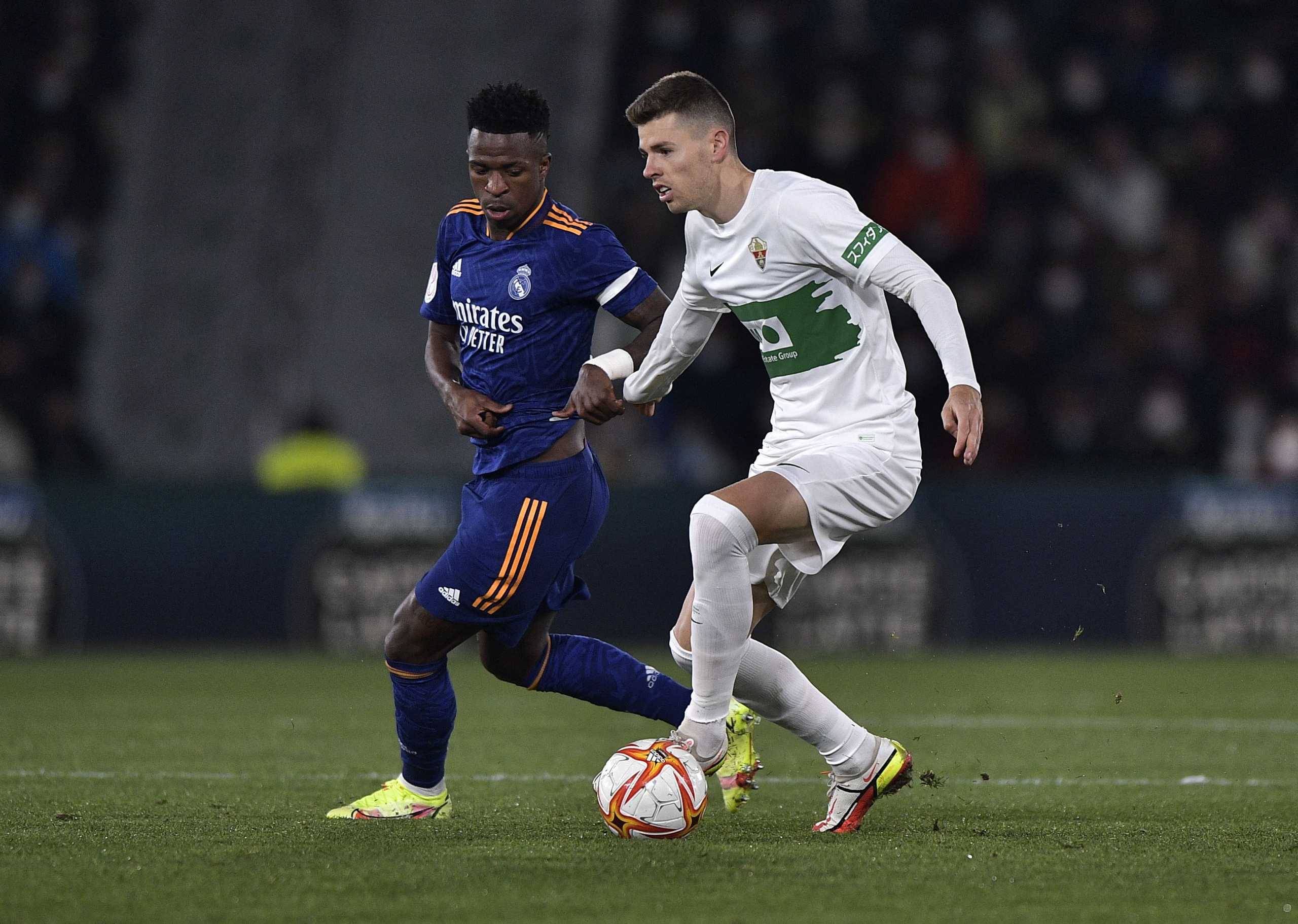 Soccer Football - Copa del Rey - Round of 16 - Elche v Real Madrid - Estadio Manuel Martinez Valero, Elche, Spain - January 20, 2022 Elche's Gerard Gumbau in action with Real Madrid's Vinicius Junior REUTERS