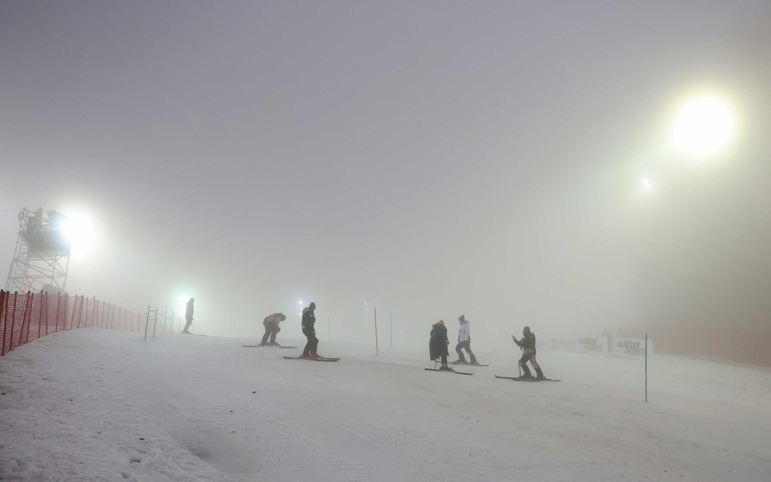 Alpine Skiing - FIS Alpine Ski World Cup Slalom - Zagreb, Croatia - January 5, 2022 Officials inspect the slope before the race was cancelled REUTERS