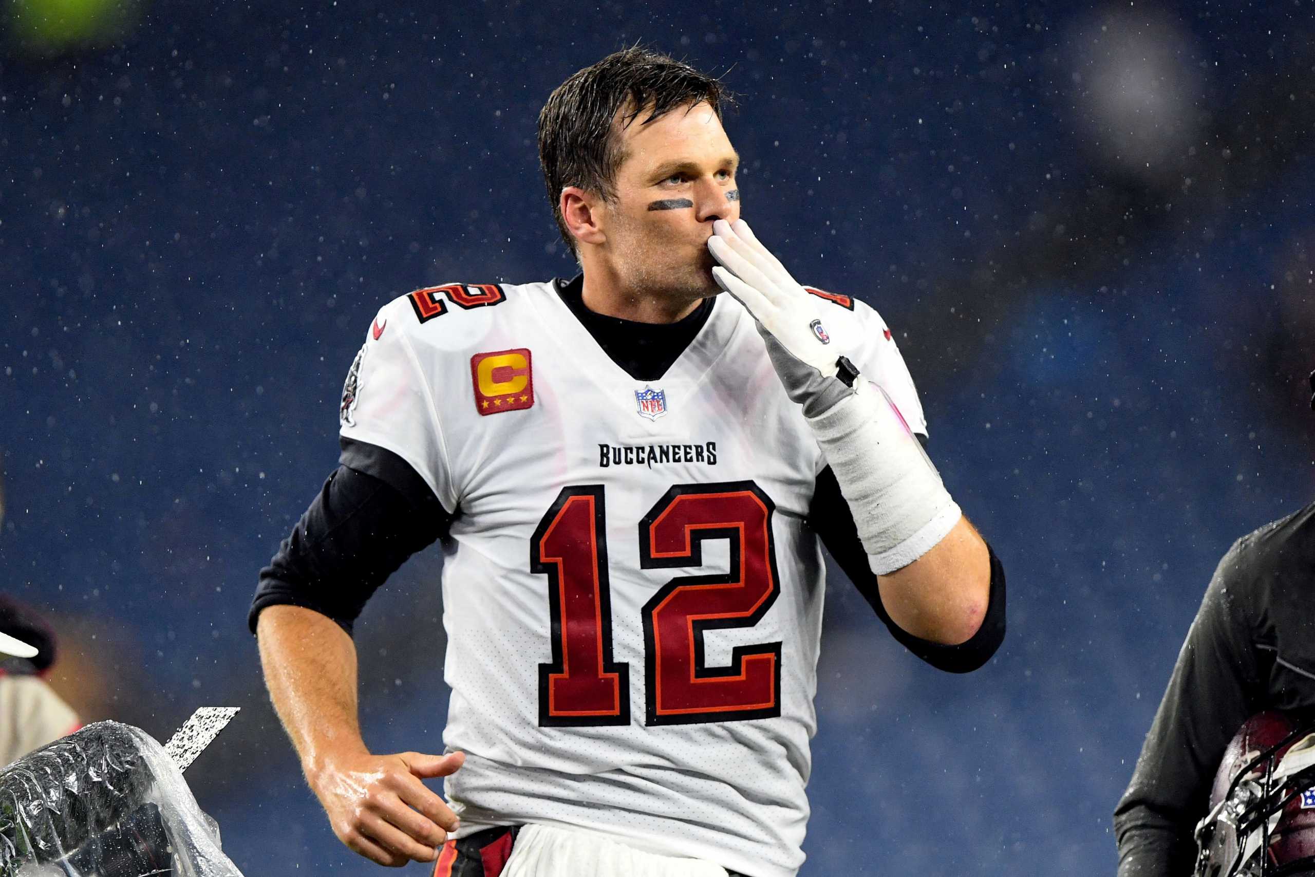 FILE PHOTO: Oct 3, 2021; Foxborough, Massachusetts, USA; Tampa Bay Buccaneers quarterback Tom Brady (12) blows a kiss to fans after a game against the New England Patriots at Gillette Stadium. Mandatory Credit: Brian Fluharty-USA TODAY Sports     TPX IMAGES OF THE DAY - 16888160
