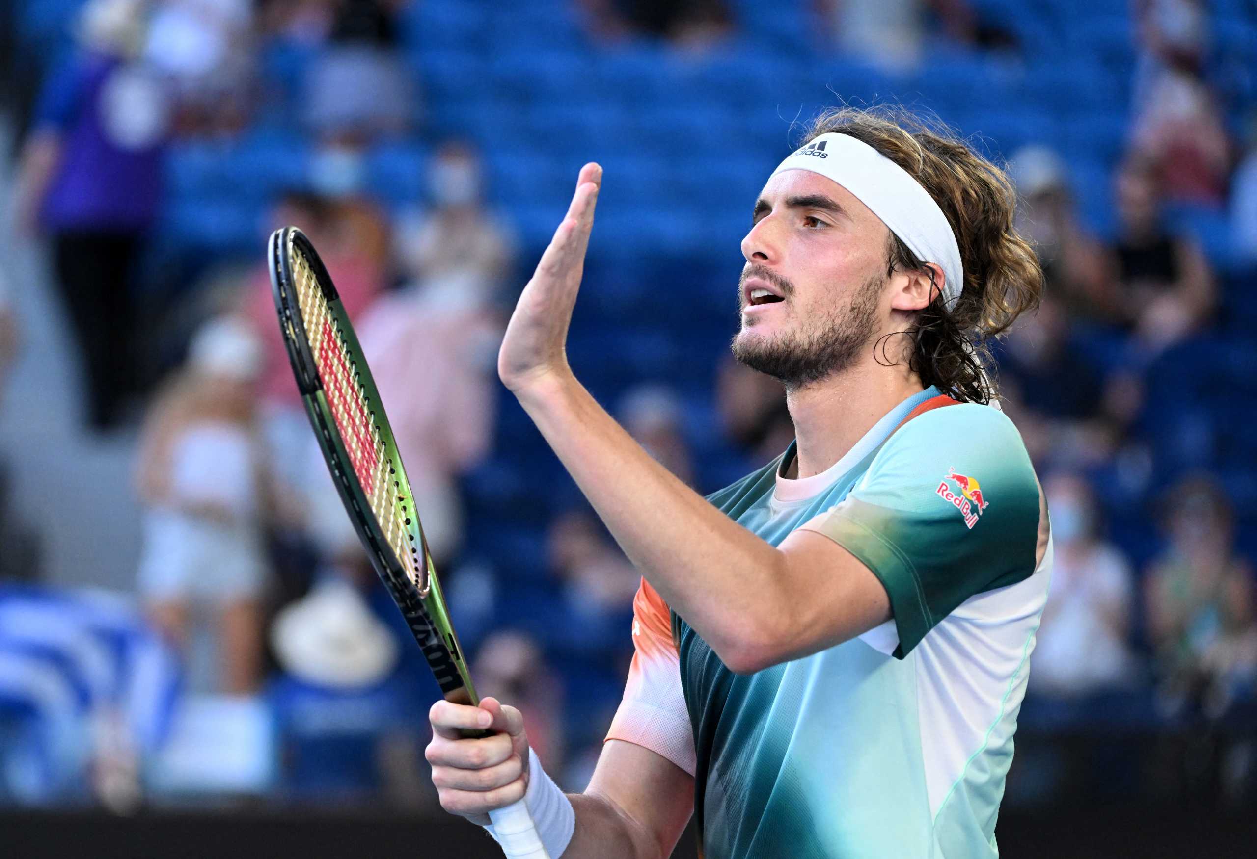 Tennis - Australian Open - Melbourne Park, Melbourne, Australia - January 22, 2022  Greece's Stefanos Tsitsipas celebrates winning his third round match against France's Benoit Paire REUTERS