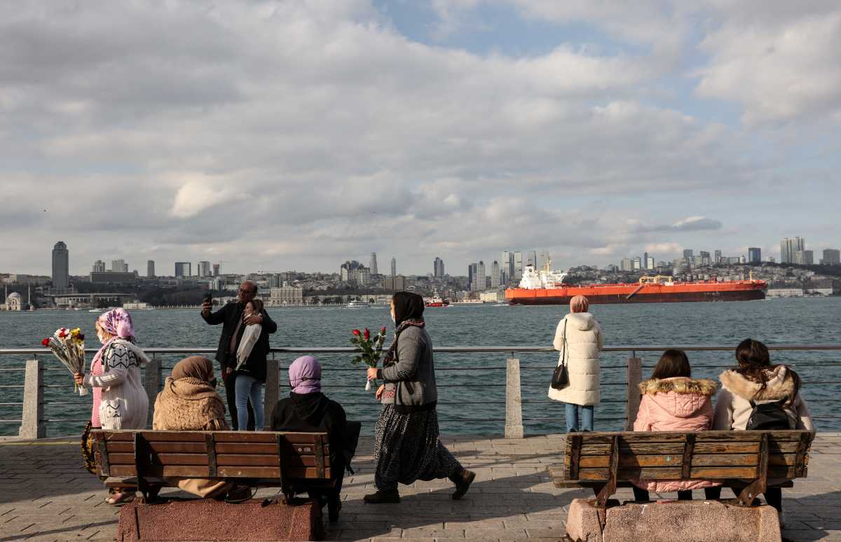 People enjoy a sunny winter day by the Bosphorus in Istanbul, Turkey, January 29, 2022. REUTERS