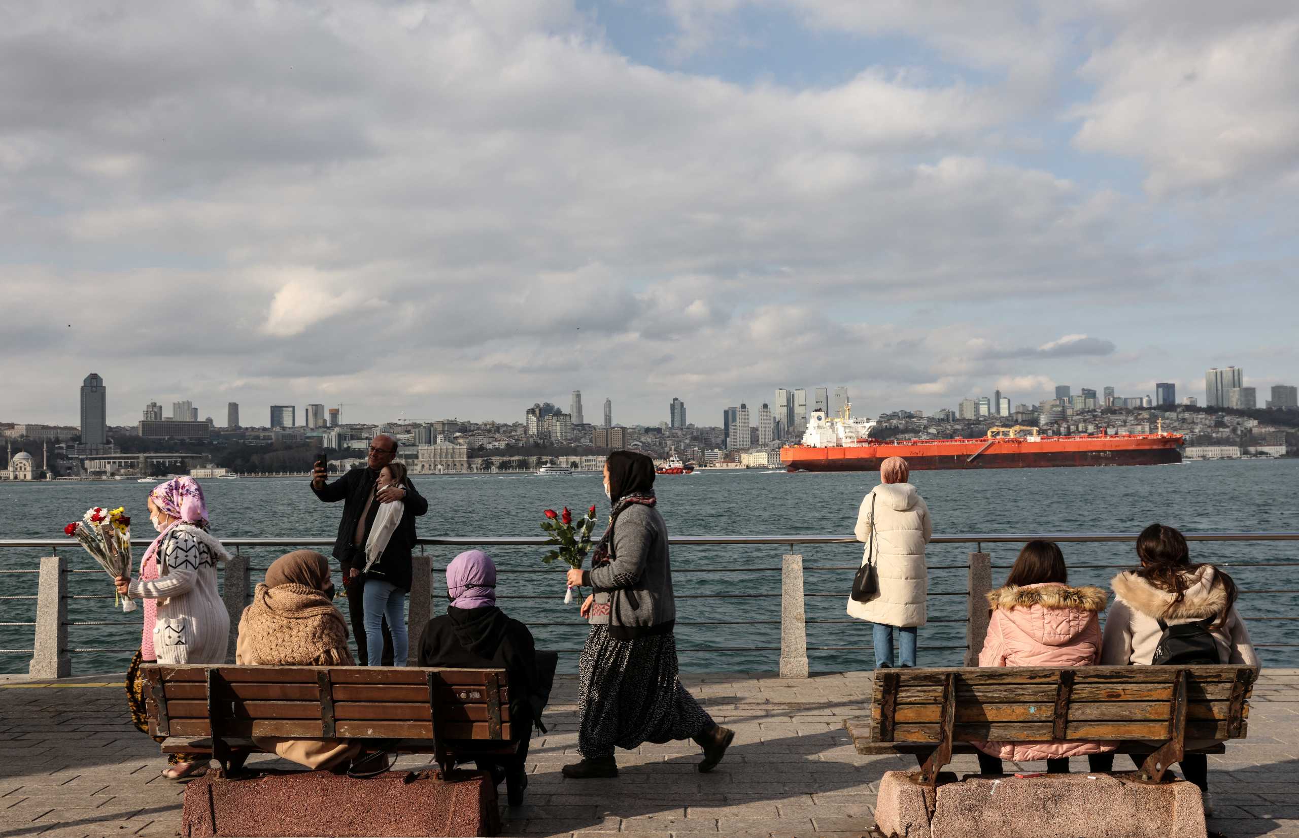 People enjoy a sunny winter day by the Bosphorus in Istanbul, Turkey, January 29, 2022. REUTERS