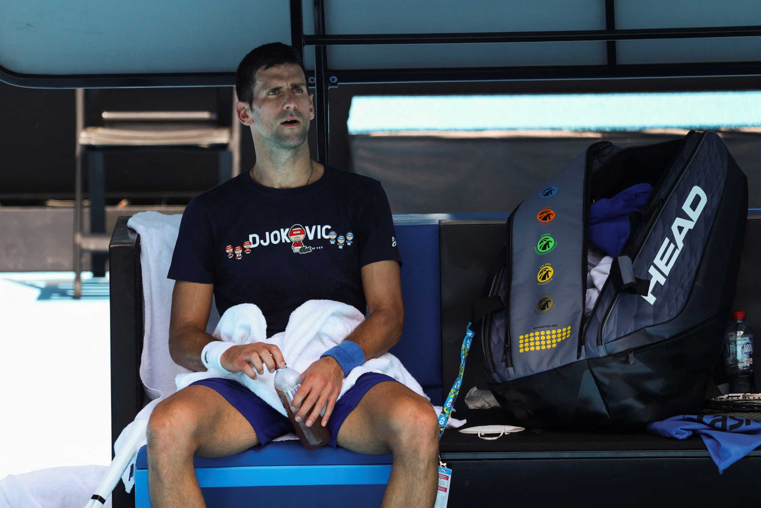 Serbian tennis player Novak Djokovic rests at Melbourne Park as questions remain over the legal battle regarding his visa to play in the Australian Open in Melbourne, Australia, January 12, 2022.  REUTERS