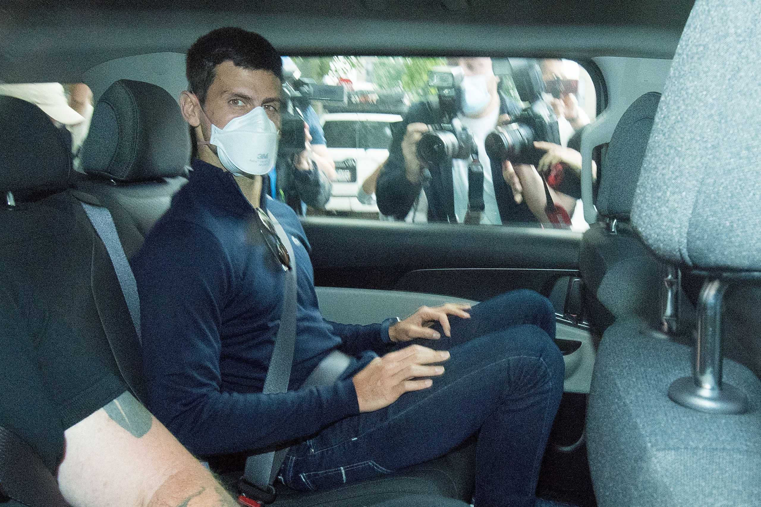 Serbian tennis player Novak Djokovic departs from the Park Hotel government detention facility before attending a court hearing at his lawyers office in Melbourne, Australia, January 16, 2022. AAP Image