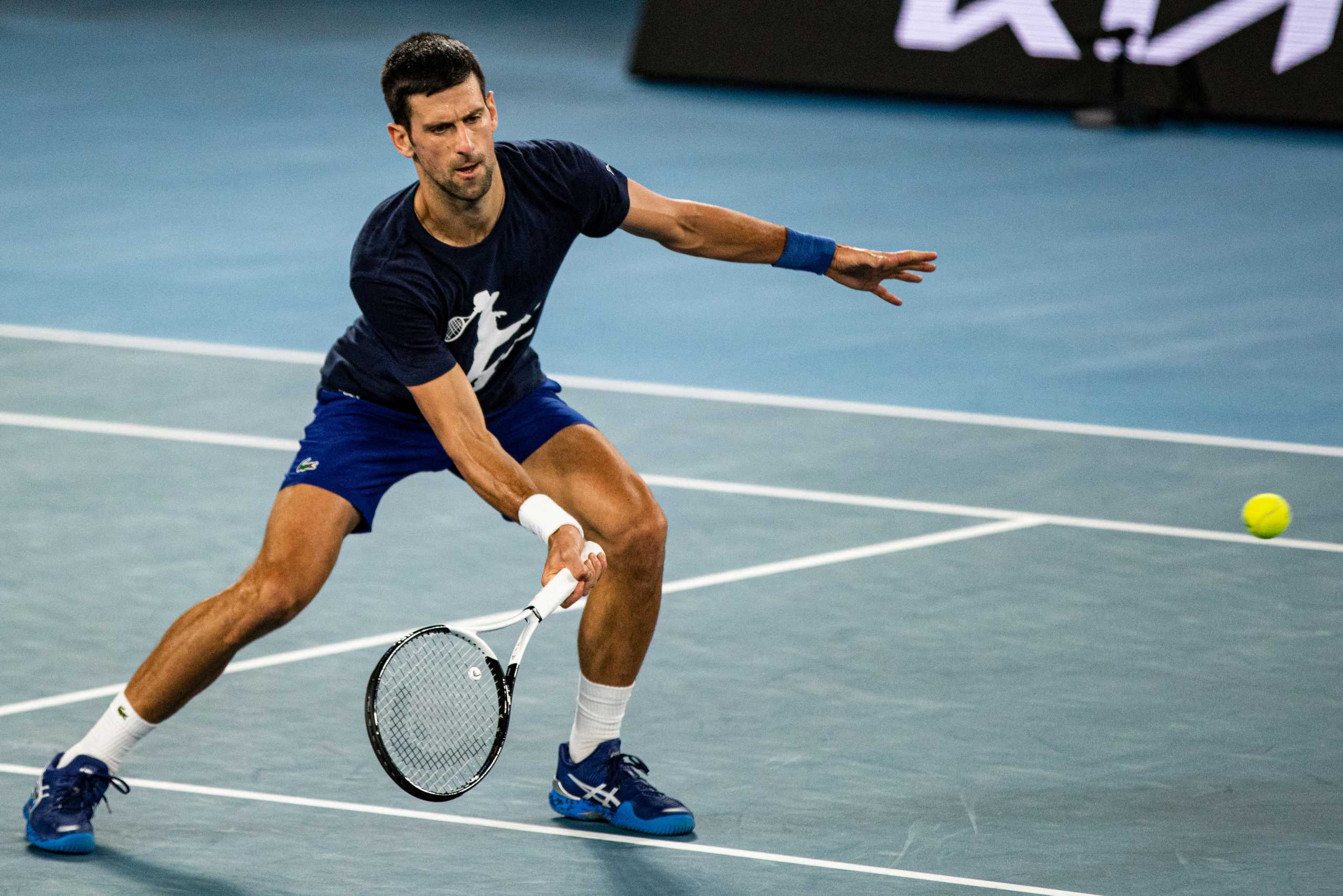 Serbian tennis player Novak Djokovic practices at Melbourne Park as questions remain over the legal battle regarding his visa to play in the Australian Open in Melbourne, Australia, January 14, 2022.  AAP Image