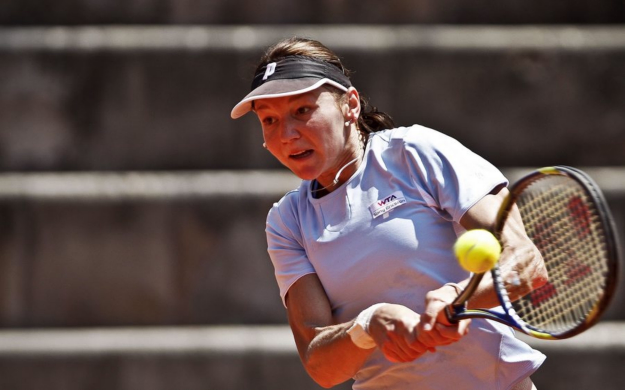 epa02703572 Czech Republic tennis player Renata Voracova in action during her match against Jarmila Gajdosova of Australia, 26 April 2011, at the Tennis Estoril Open, in Oeiras, Portugal.  EPA