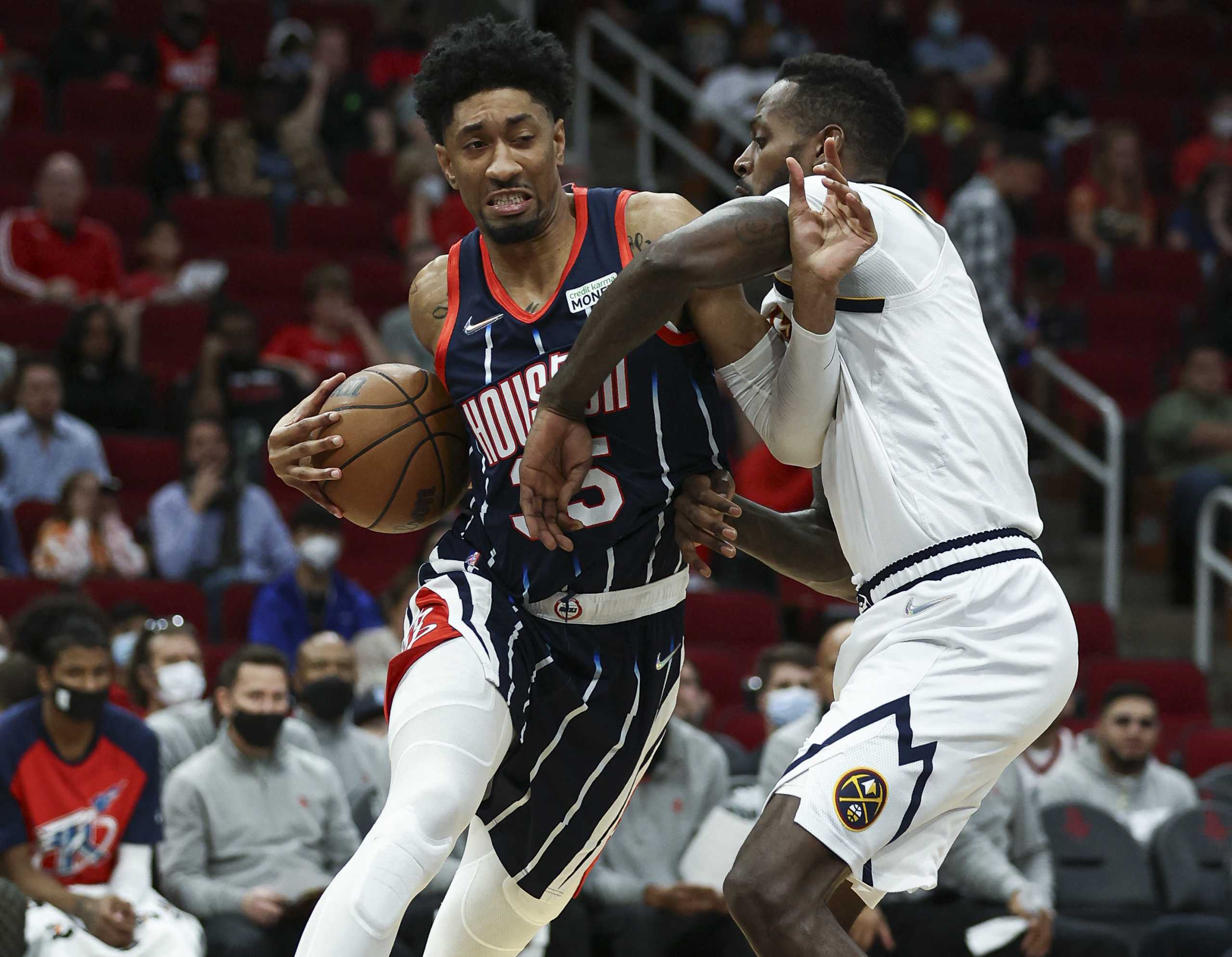 Jan 1, 2022; Houston, Texas, USA; Houston Rockets center Christian Wood (35) drives to the basket as Denver Nuggets forward JaMychal Green (0) defends during the second quarter at Toyota Center. Mandatory Credit: Troy Taormina-USA TODAY Sports