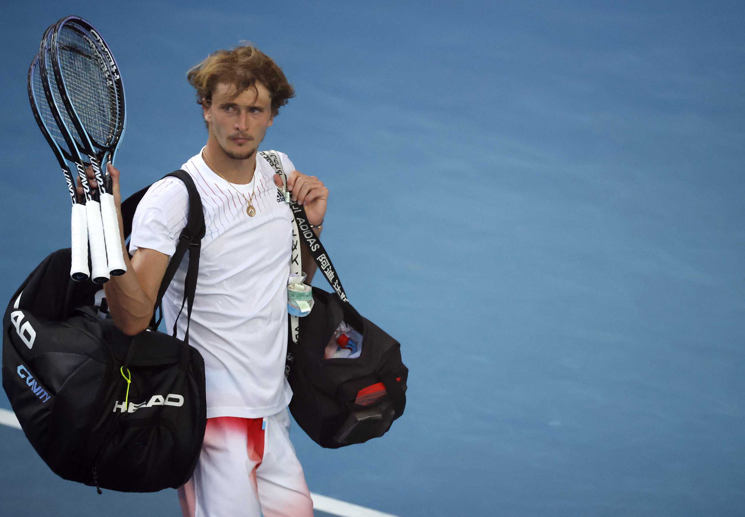 Tennis - Australian Open - Melbourne Park, Melbourne, Australia - January 23, 2022  Germany's Alexander Zverev acknowledges fans as he walks off the court dejected after losing his fourth round match against Canada's Denis Shapovalov REUTERS