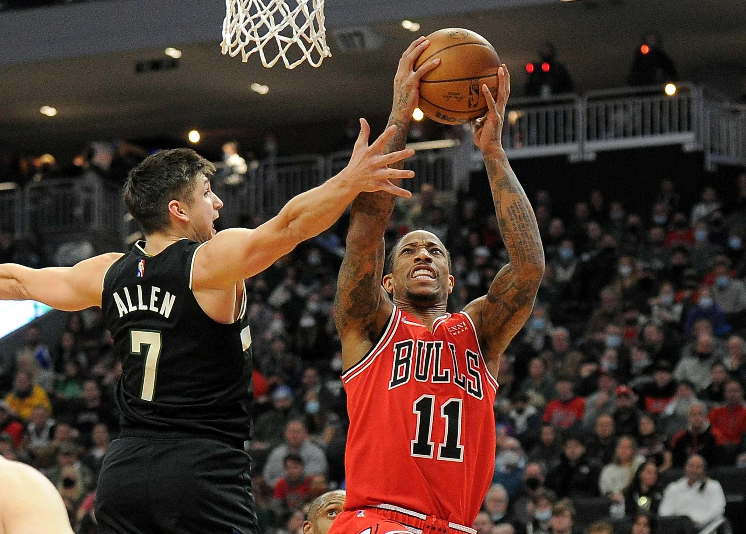Jan 21, 2022; Milwaukee, Wisconsin, USA;  Chicago Bulls forward DeMar DeRozan (11) drives to the basket against Milwaukee Bucks guard Grayson Allen (7) in the first half at Fiserv Forum. Mandatory Credit: Michael McLoone-USA TODAY Sports