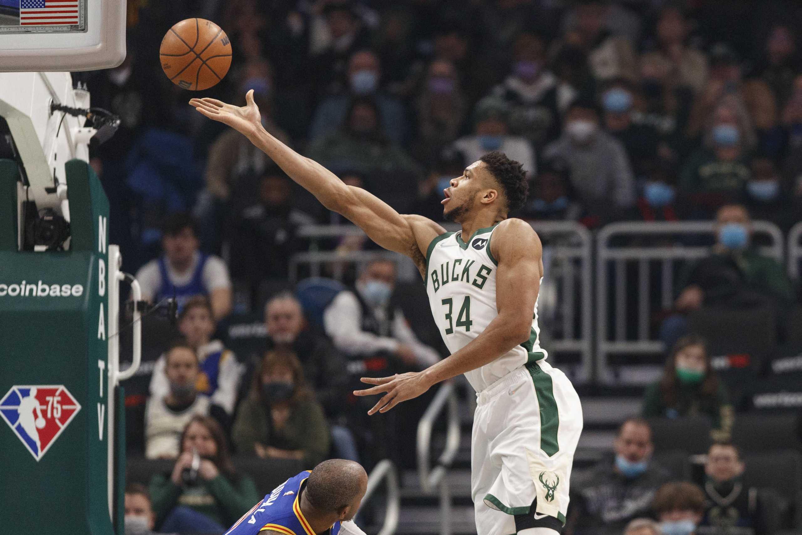 Jan 13, 2022; Milwaukee, Wisconsin, USA;  Milwaukee Bucks forward Giannis Antetokounmpo (34) shoots during the first quarter against the Golden State Warriors at Fiserv Forum. Mandatory Credit: Jeff Hanisch-USA TODAY Sports