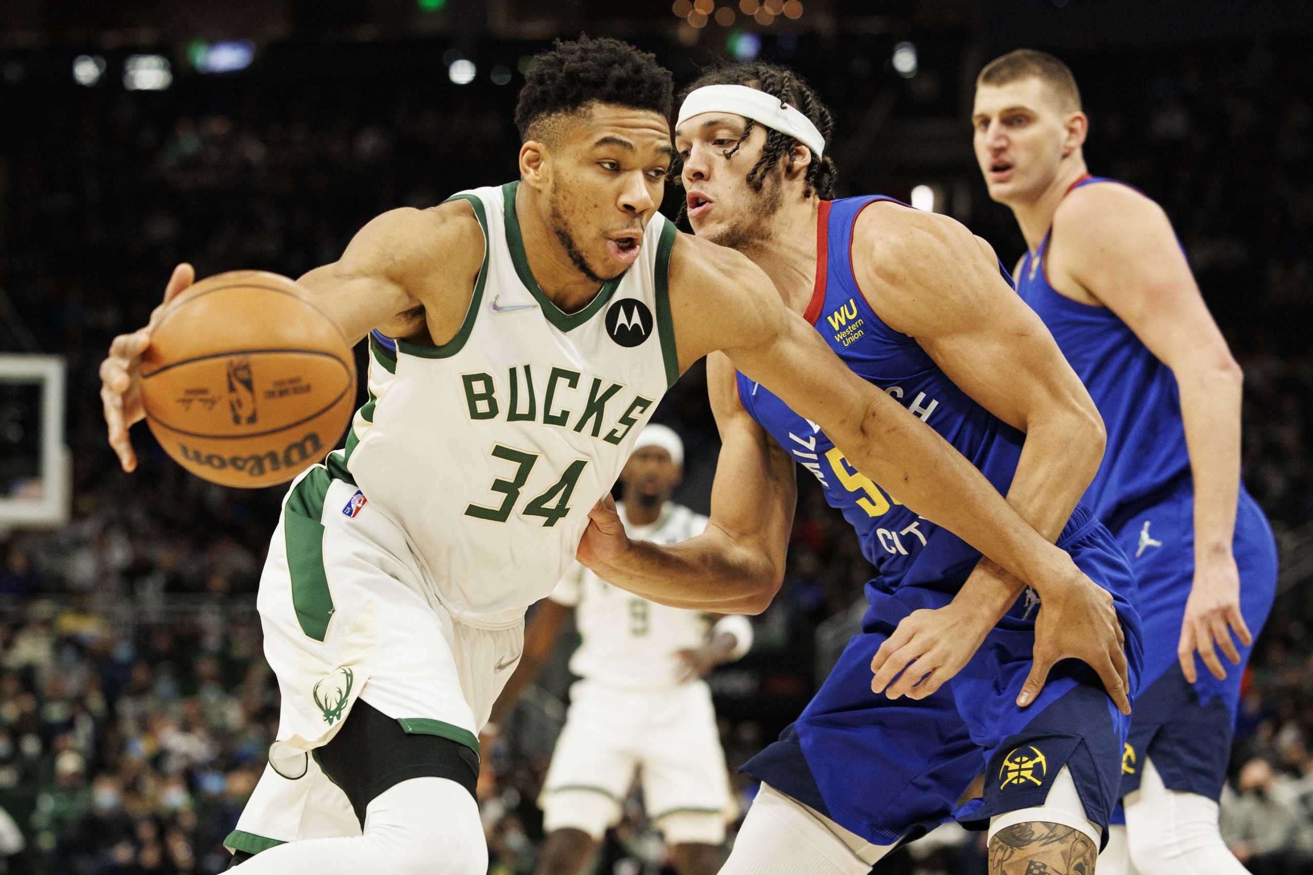 Jan 30, 2022; Milwaukee, Wisconsin, USA;  Milwaukee Bucks forward Giannis Antetokounmpo (34) drives for the basket against Denver Nuggets forward Aaron Gordon (50) during the first quarter at Fiserv Forum. Mandatory Credit: Jeff Hanisch-USA TODAY Sports