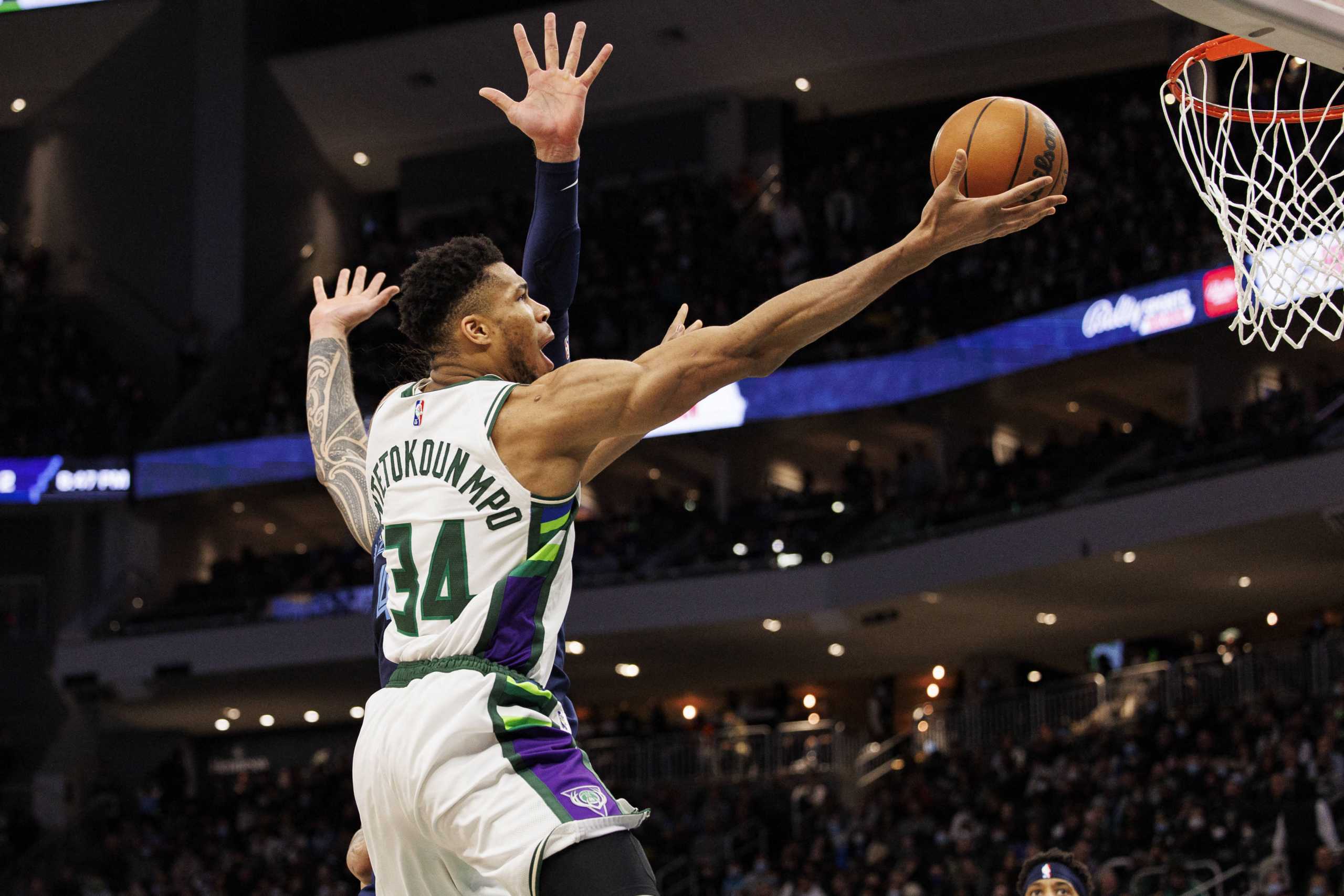 Jan 19, 2022; Milwaukee, Wisconsin, USA;  Milwaukee Bucks forward Giannis Antetokounmpo (34) shoots during the third quarter against the Memphis Grizzlies at Fiserv Forum. Mandatory Credit: Jeff Hanisch-USA TODAY Sports