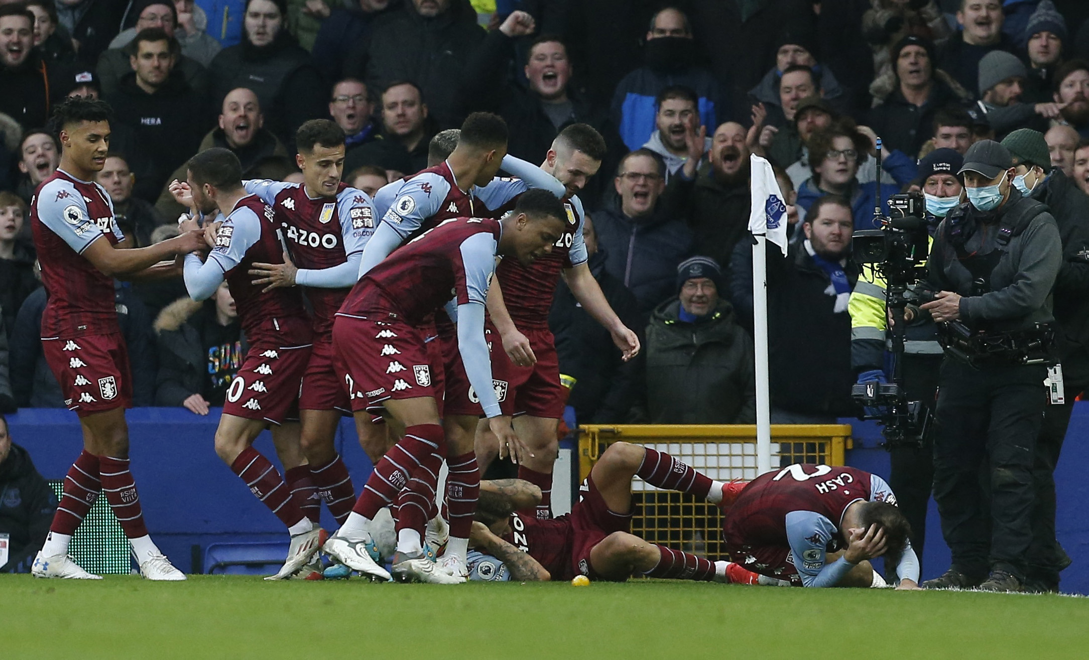 Soccer Football - Premier League - Everton v Aston Villa - Goodison Park, Liverpool, Britain - January 22, 2022 Aston Villa's Lucas Digne and Matty Cash react after being hit by an object REUTERS