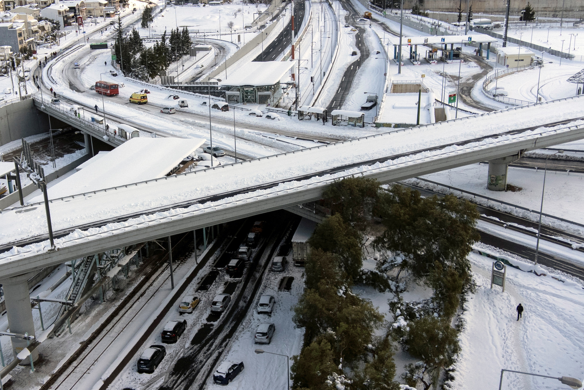Abandoned vehicles are covered in snow on the Attiki Odos motorway, following heavy snowfall in Athens, Greece, January 25, 2022. Picture taken with a drone. REUTERS