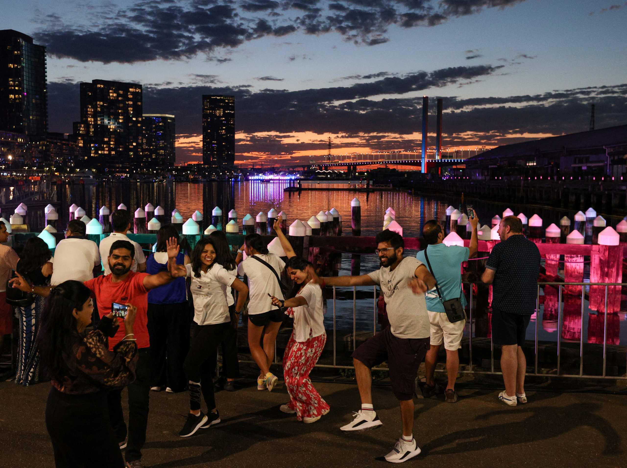 People celebrate New Year's Eve on the Yarra River waterfront, as the Omicron variant of the coronavirus disease (COVID-19) continues to spread, in Melbourne, Australia, December 31, 2021.  REUTERS