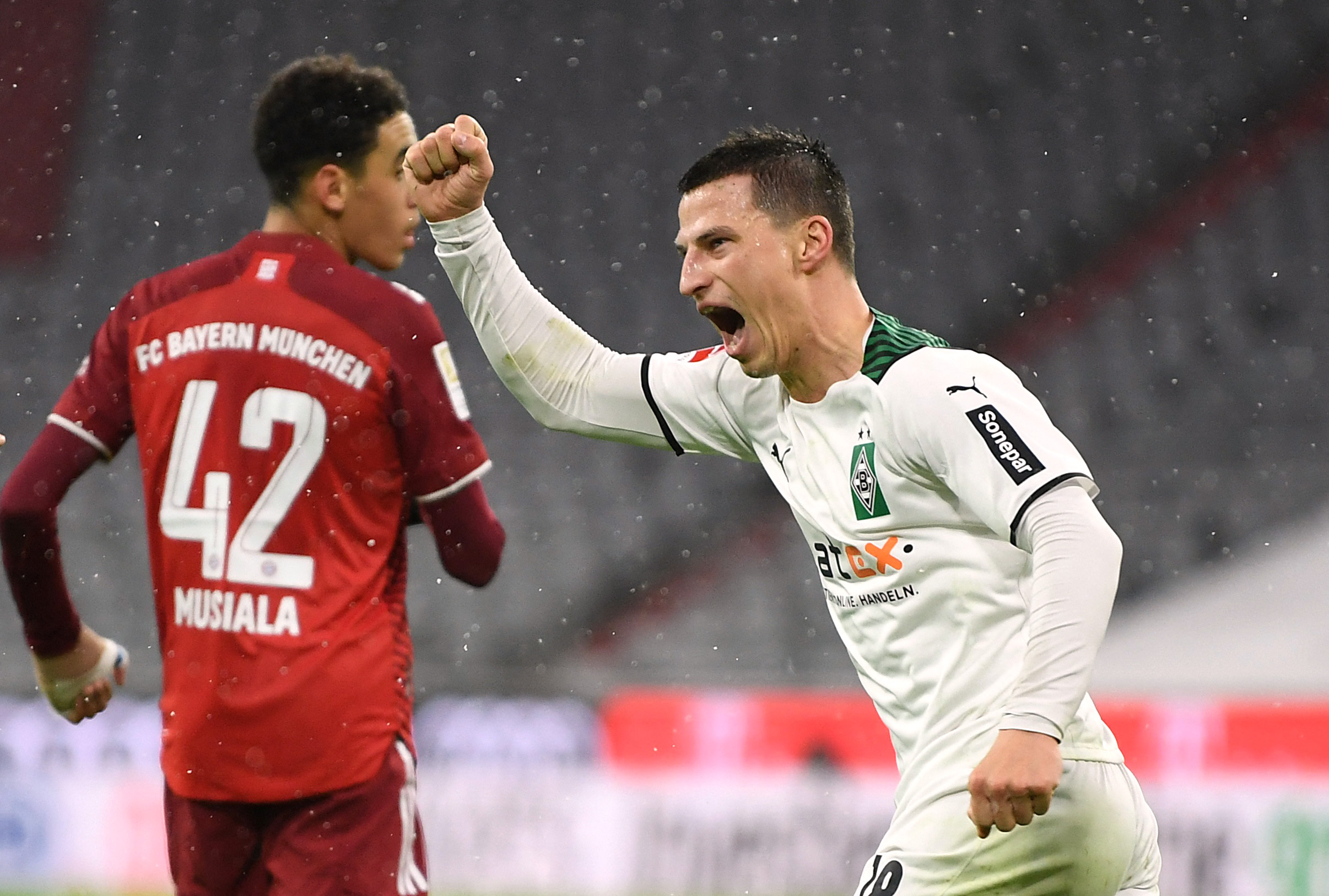 Soccer Football - Bundesliga - Bayern Munich v Borussia Moenchengladbach - Allianz Arena, Munich, Germany - January 7, 2022 Borussia Moenchengladbach's Stefan Lainer celebrates scoring their second goal REUTERS