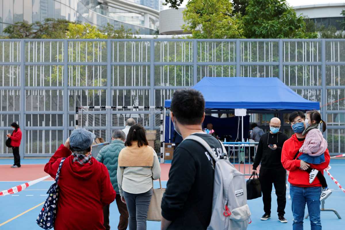 People queue up at a makeshift community testing centre for the coronavirus disease (COVID-19), in Hong Kong, China January 9, 2022. REUTERS
