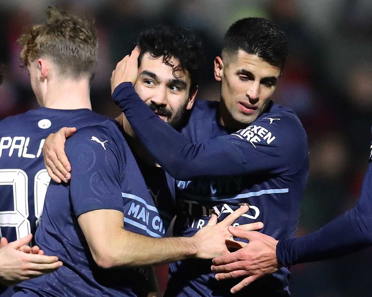 Soccer Football - FA Cup Third Round - Swindon Town v Manchester City - County Ground, Swindon, Britain - January 7, 2022 Manchester City's Ilkay Gundogan celebrates scoring their third goal with teammates REUTERS