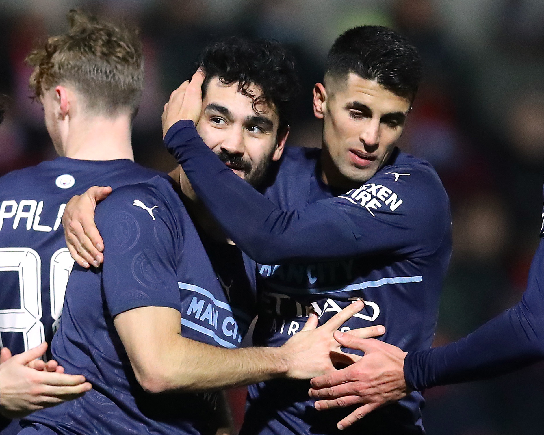 Soccer Football - FA Cup Third Round - Swindon Town v Manchester City - County Ground, Swindon, Britain - January 7, 2022 Manchester City's Ilkay Gundogan celebrates scoring their third goal with teammates REUTERS