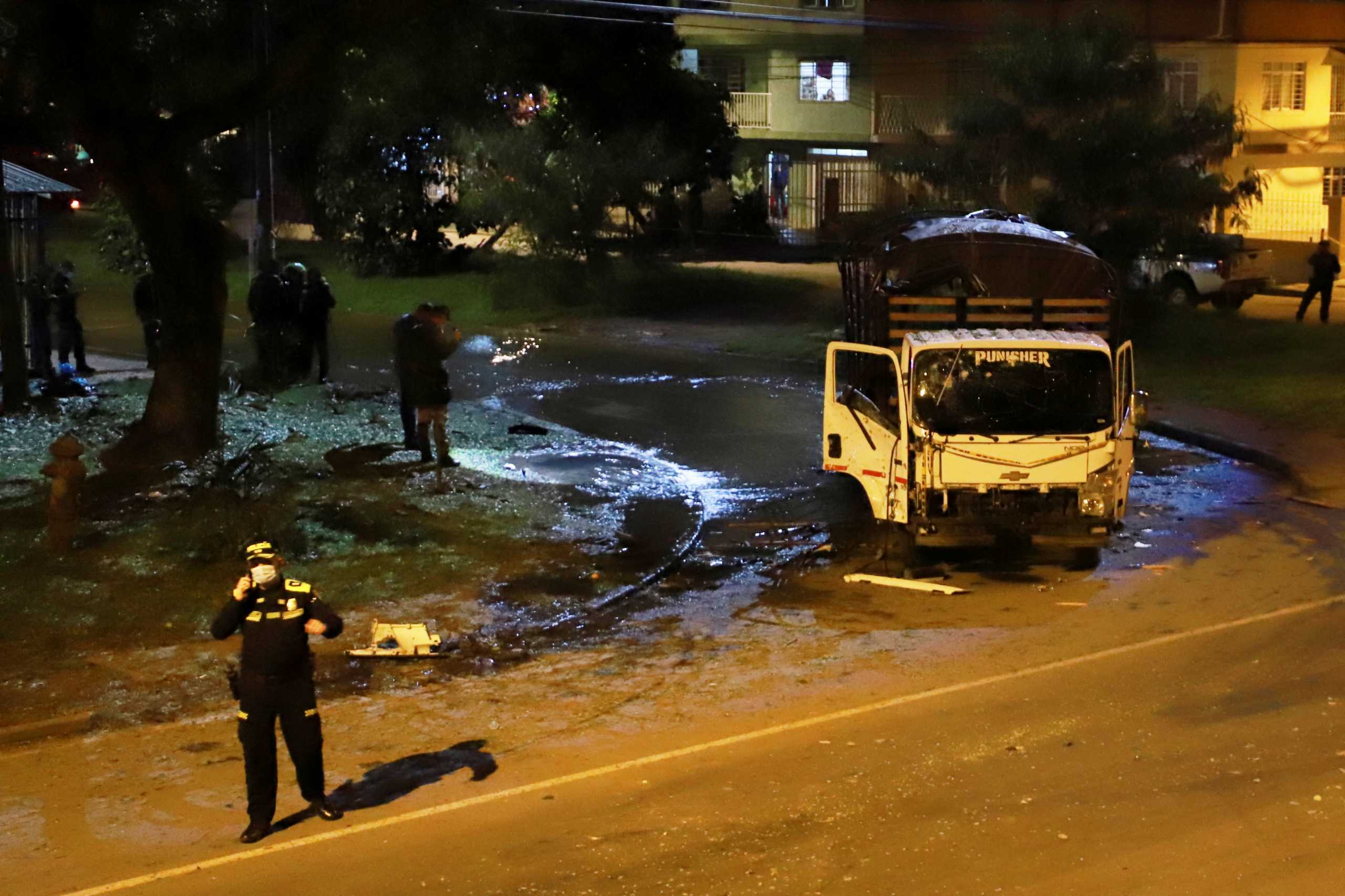 A destroyed truck of the Police Mobile Anti-Riot Squad (ESMAD) is seen after an explosion in Cali, Colombia January 7, 2022. Picture taken January 7, 2022. REUTERS