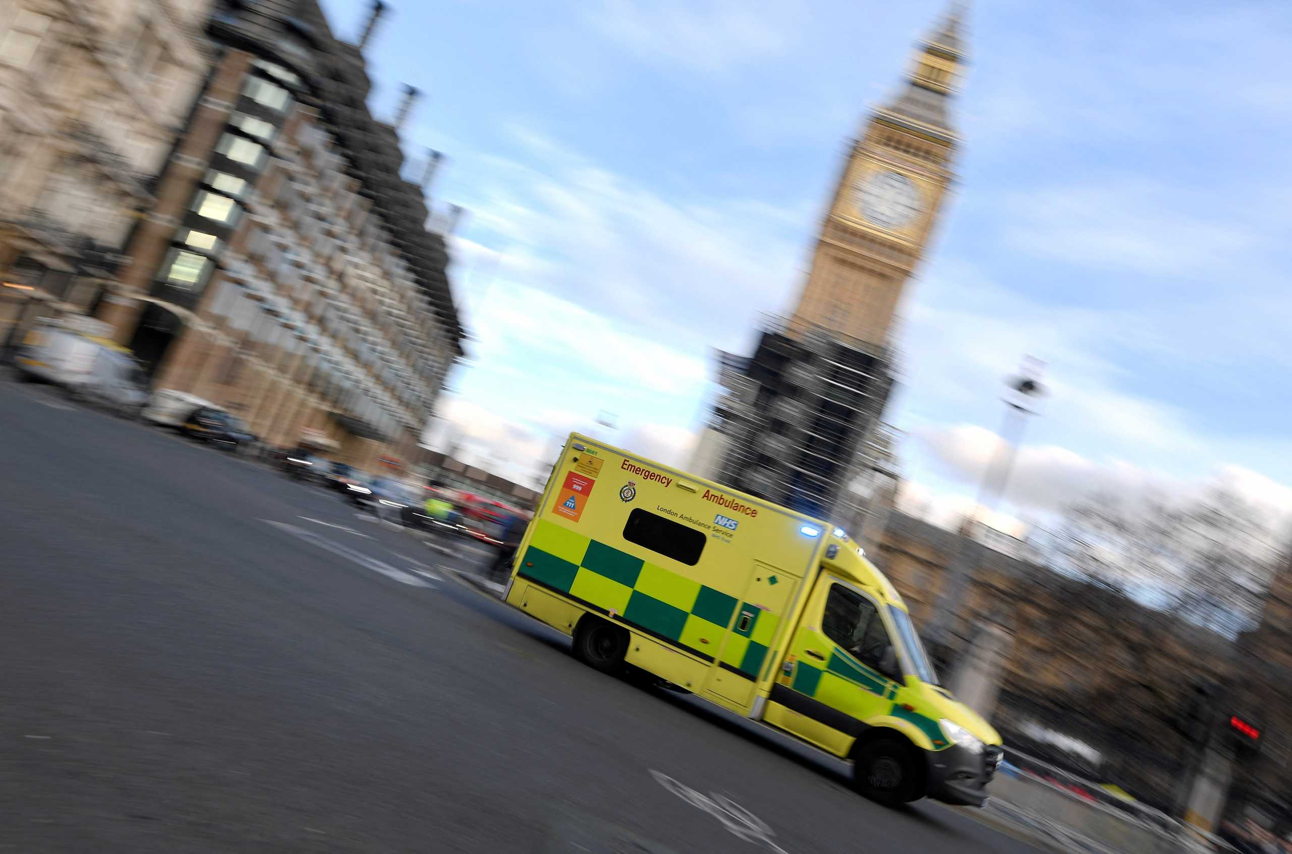 An ambulance is driven past the Houses of Parliament as it attends an emergency call, amidst the spread of the coronavirus disease (COVID-19) pandemic, in London, Britain, January 28, 2022. REUTERS