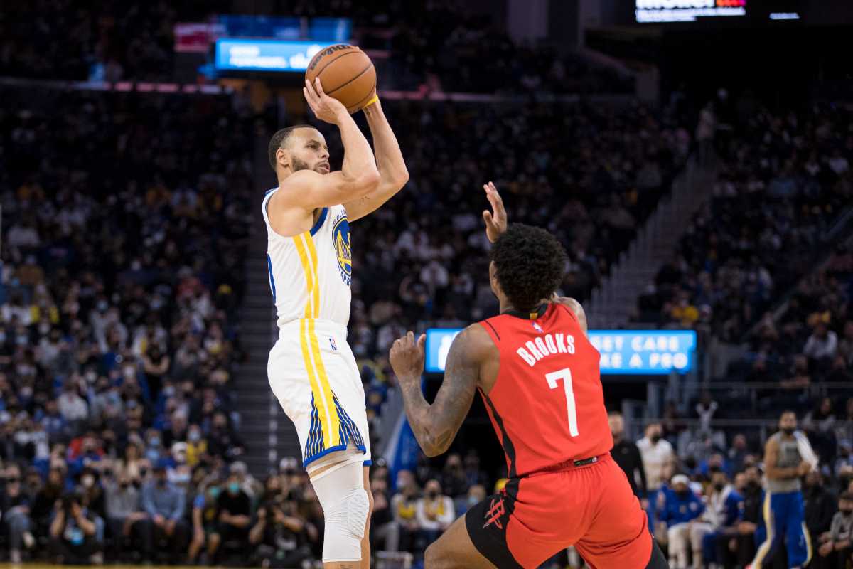 Jan 21, 2022; San Francisco, California, USA; Golden State Warriors guard Stephen Curry (30) shoots as Houston Rockets guard Armoni Brooks (7) defends during the second half at Chase Center. Mandatory Credit: John Hefti-USA TODAY Sports