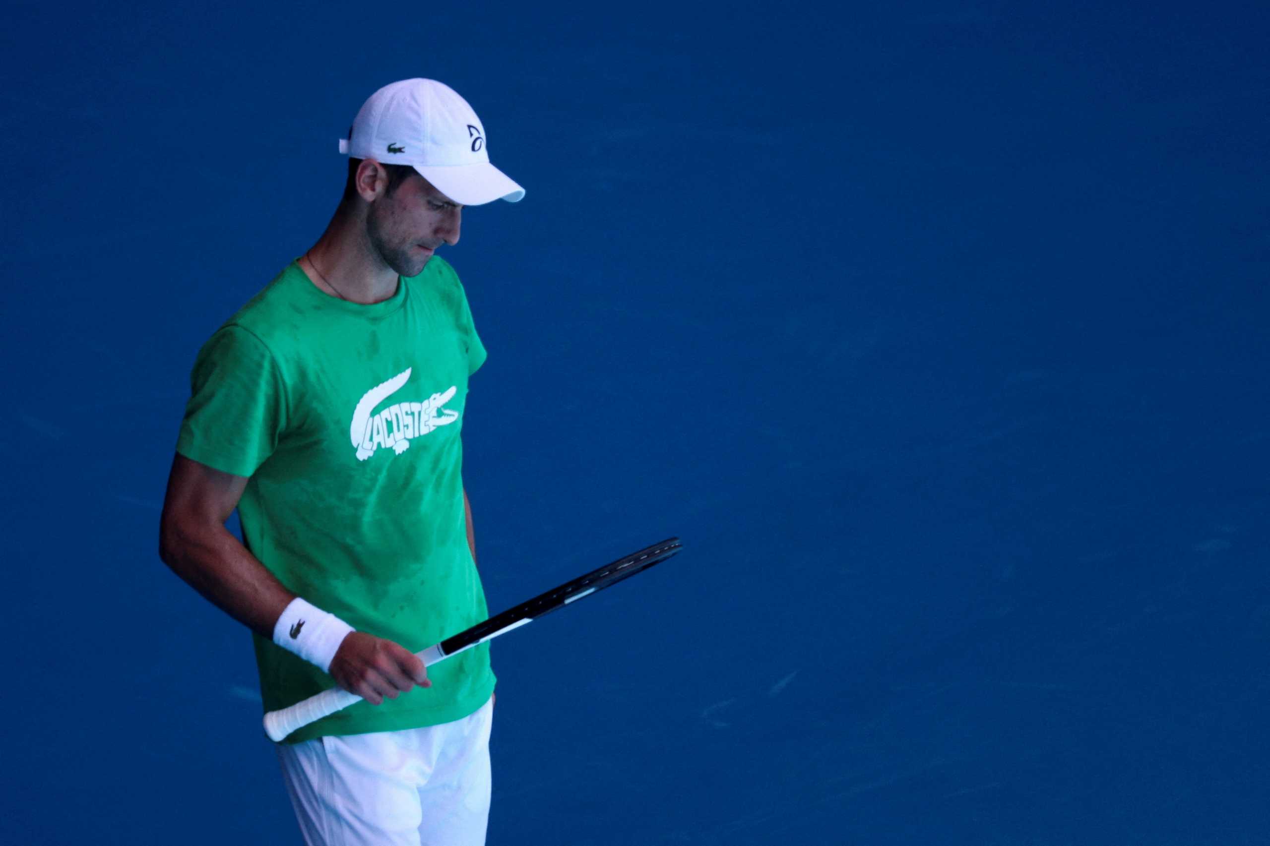 FILE PHOTO: Serbian tennis player Novak Djokovic practices at Melbourne Park before his visa was again cancelled by the Australian government in Melbourne, Australia, January 13, 2022.  REUTERS