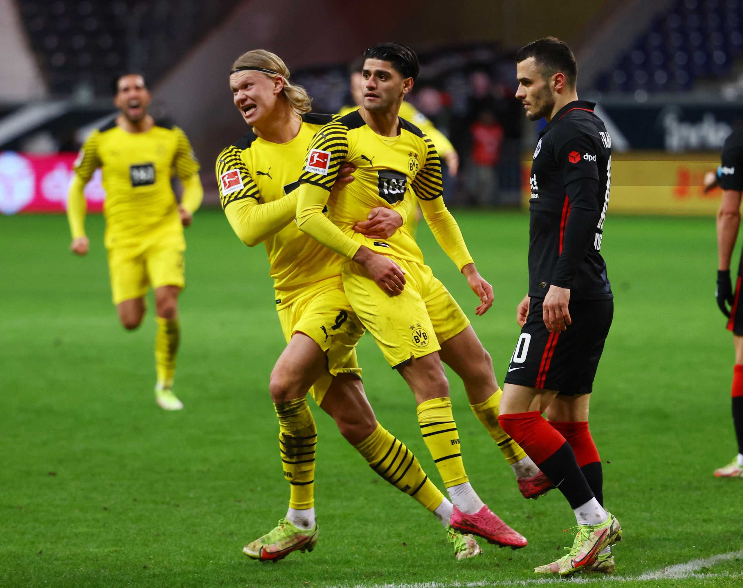 Soccer Football - Bundesliga - Eintracht Frankfurt v Borussia Dortmund - Deutsche Bank Park, Frankfurt, Germany - January 8, 2022 Borussia Dortmund's Mahmoud Dahoud celebrates scoring their third goal with Erling Braut Haaland REUTERS
