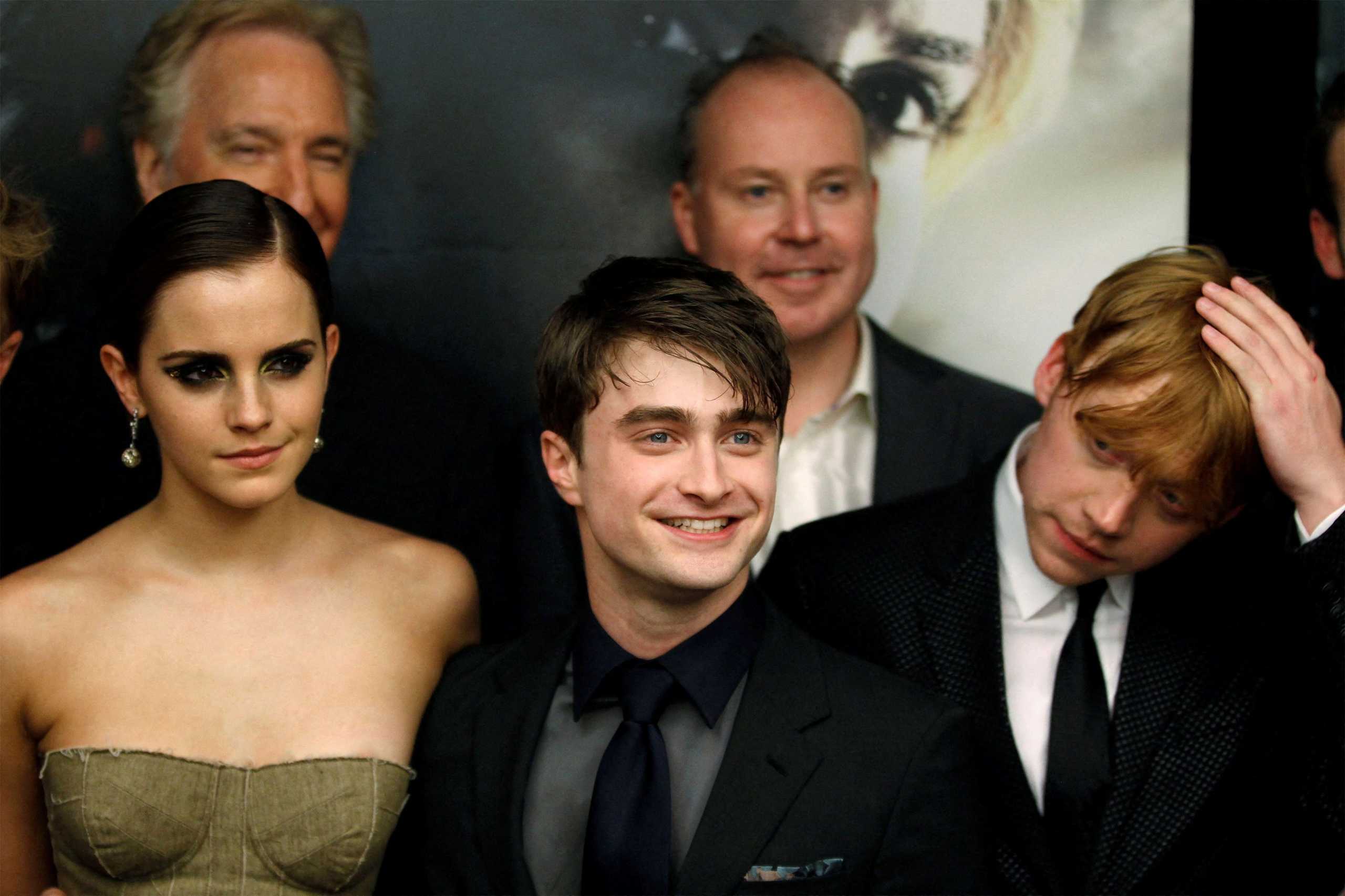 FILE PHOTO: Cast members Rupert Grint (R), Daniel Radcliffe and Emma Watson (L) arrive for the premiere of the film "Harry Potter and the Deathly Hallows: Part 2" in New York July 11, 2011.  REUTERS