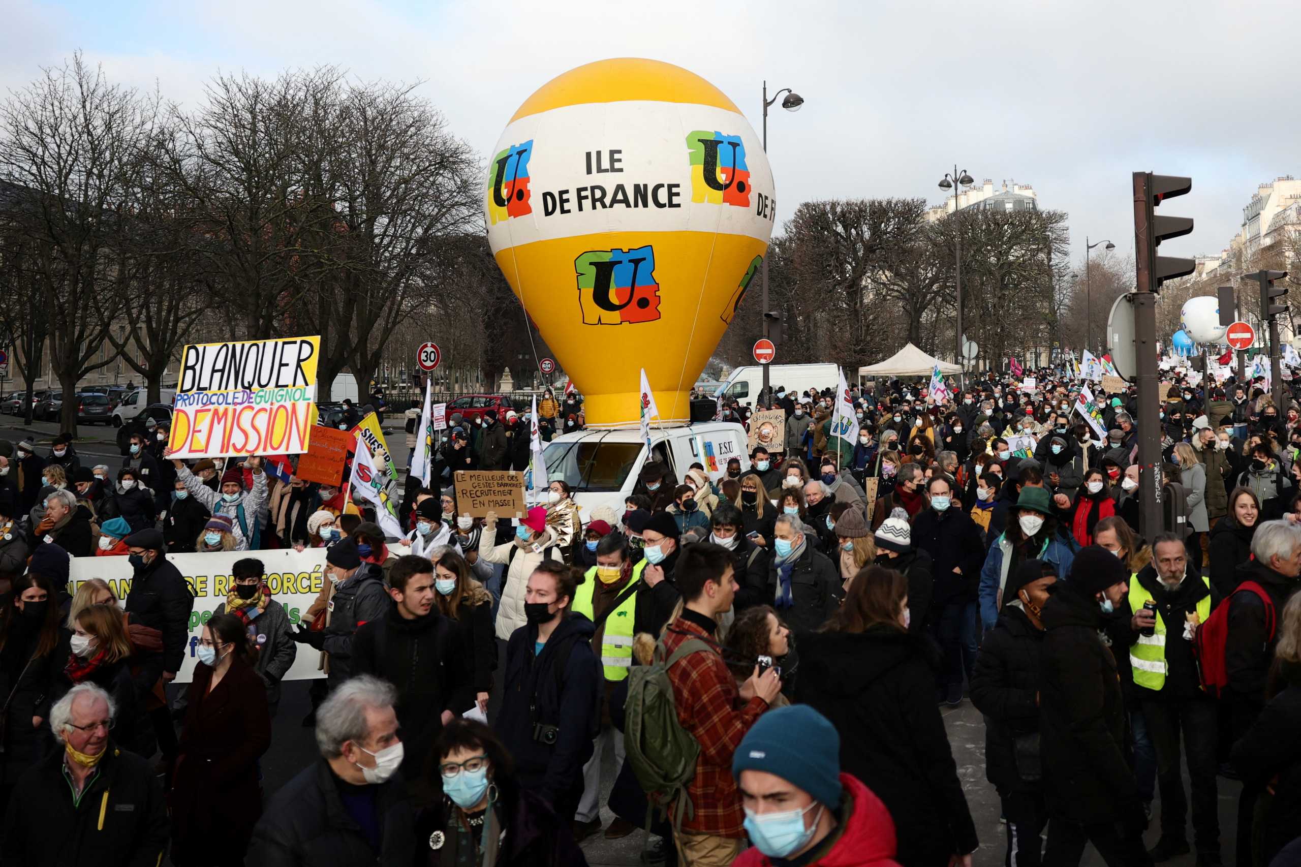 French teachers attend a demonstration as part of a nationwide day of strike and protests against sanitary conditions in schools, in Paris amid the rise of coronavirus disease (COVID-19) cases due to the Omicron variant in France, January 13, 2022. REUTERS