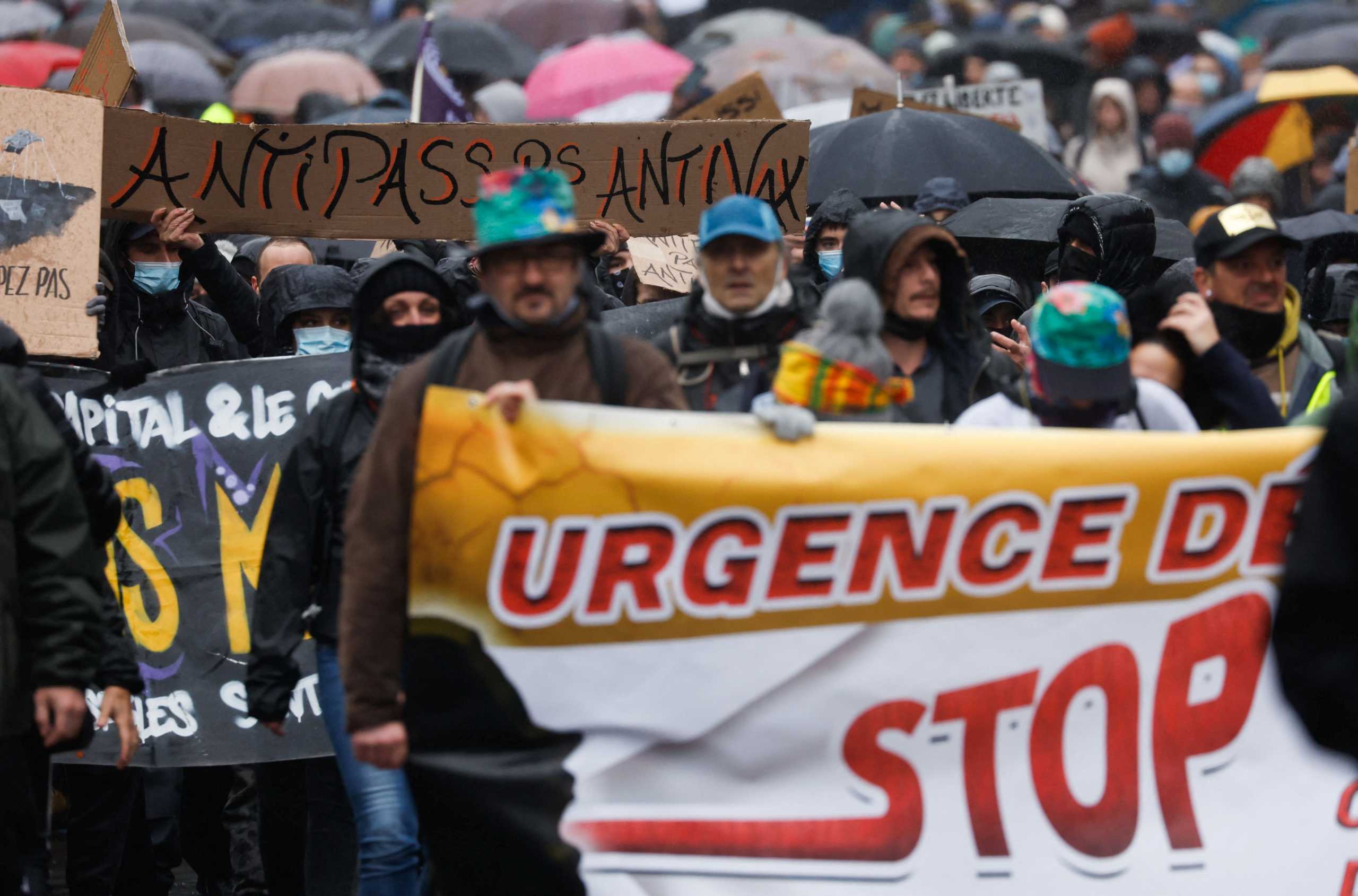 People attend a demonstration to protest against a bill that would transform France's current coronavirus disease (COVID-19) health pass into a "vaccine pass", in Nantes, France, January 8, 2022. REUTERS