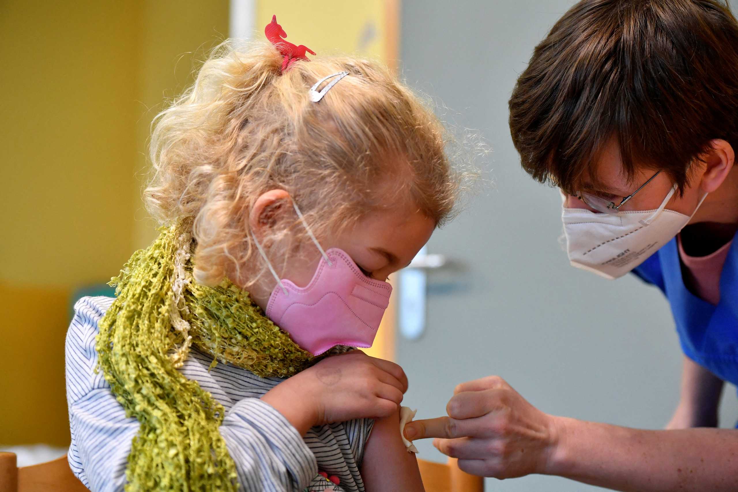 Juno, 7-years old, is vaccinated against the coronavirus disease (COVID-19) in a Children's Vaccination Center in Leipzig, Germany, December 10, 2021. REUTERS